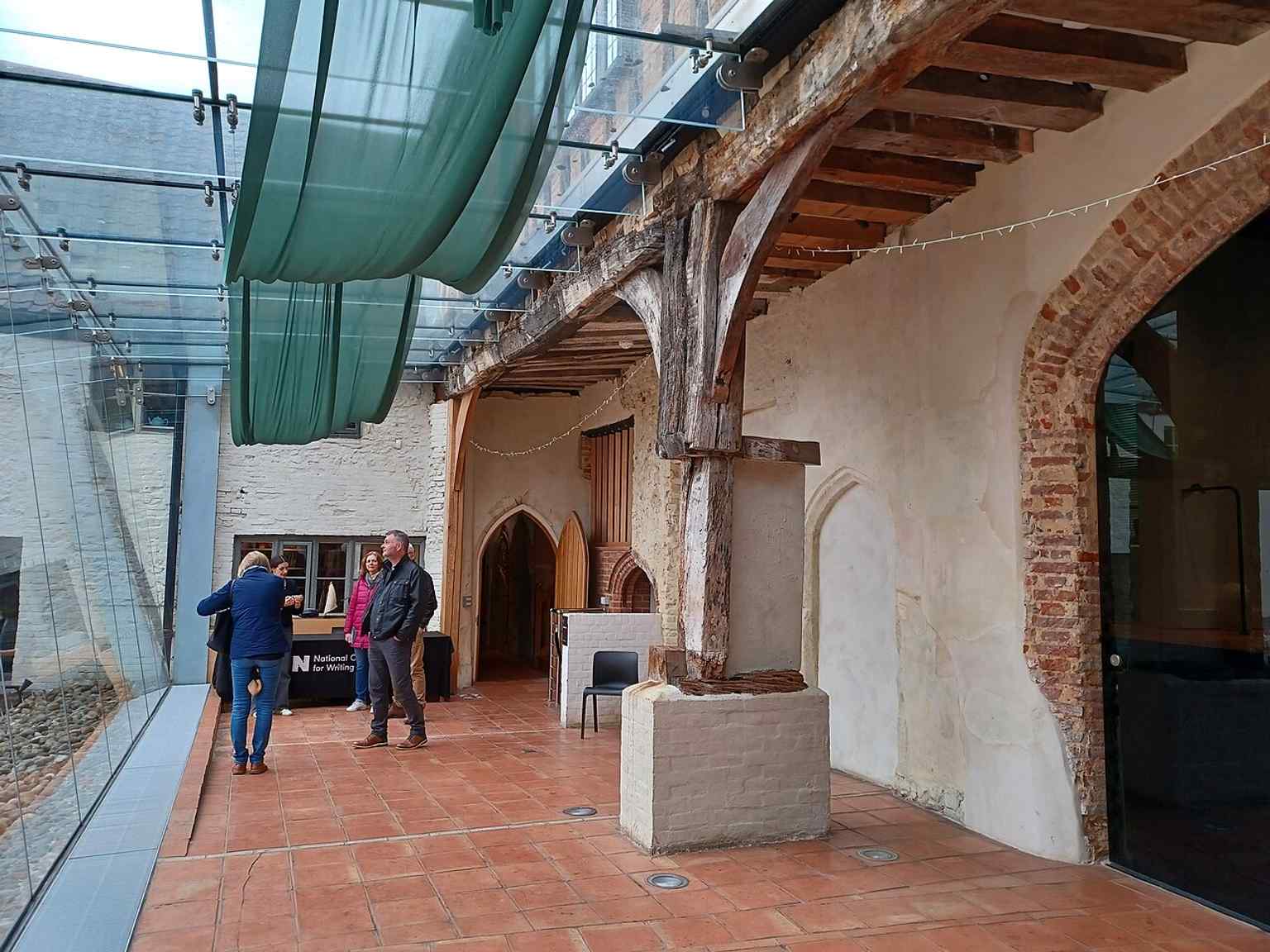 The hall’s open interior, where the crown-post roof and long proportions reflect its role as a prestigious trading space.