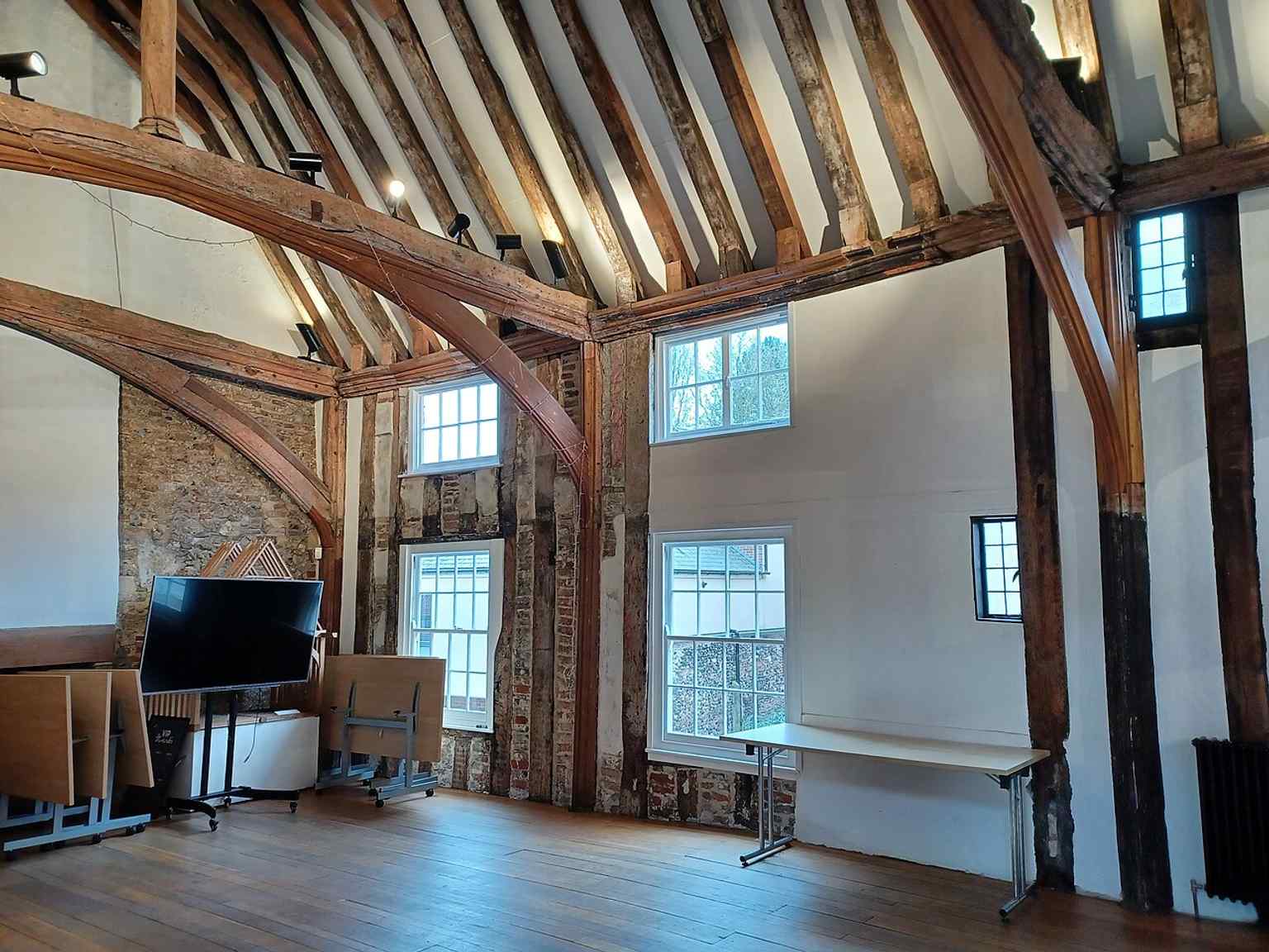 A closer look at the hall’s timber structure and carved decoration, including the famous dragon imagery that gave the building its name.