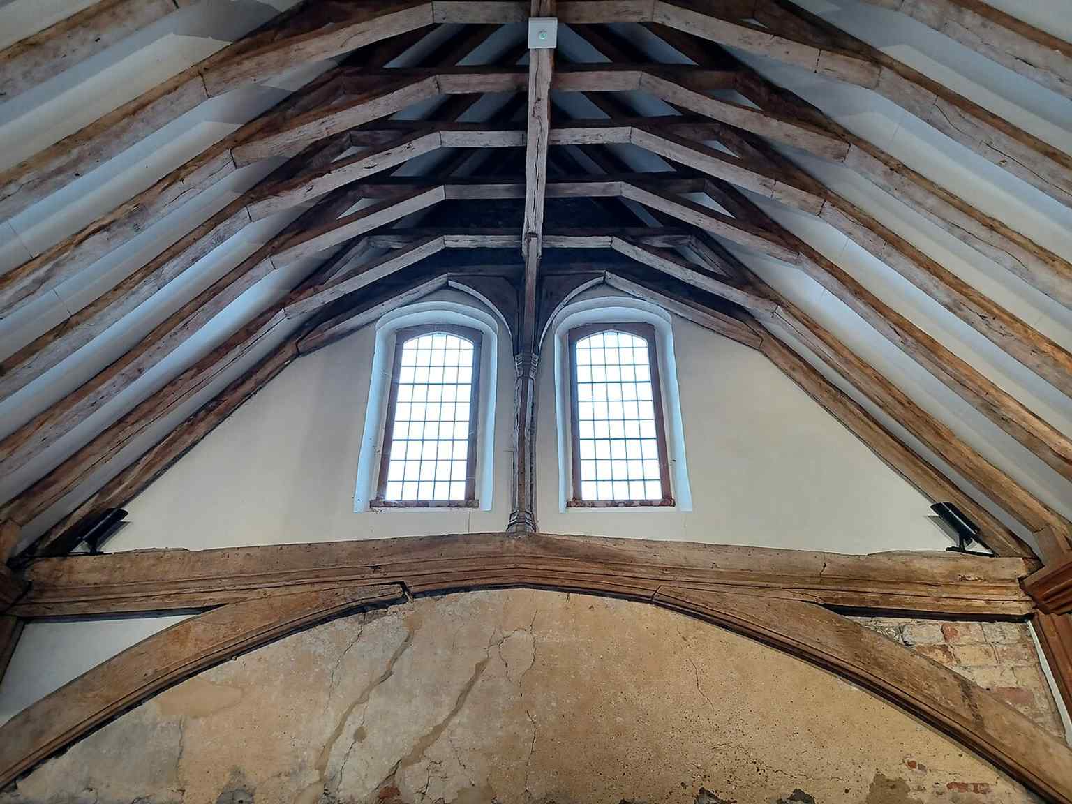 Architectural detail from the medieval hall, useful for showing the craftsmanship of the English oak roof timbers.