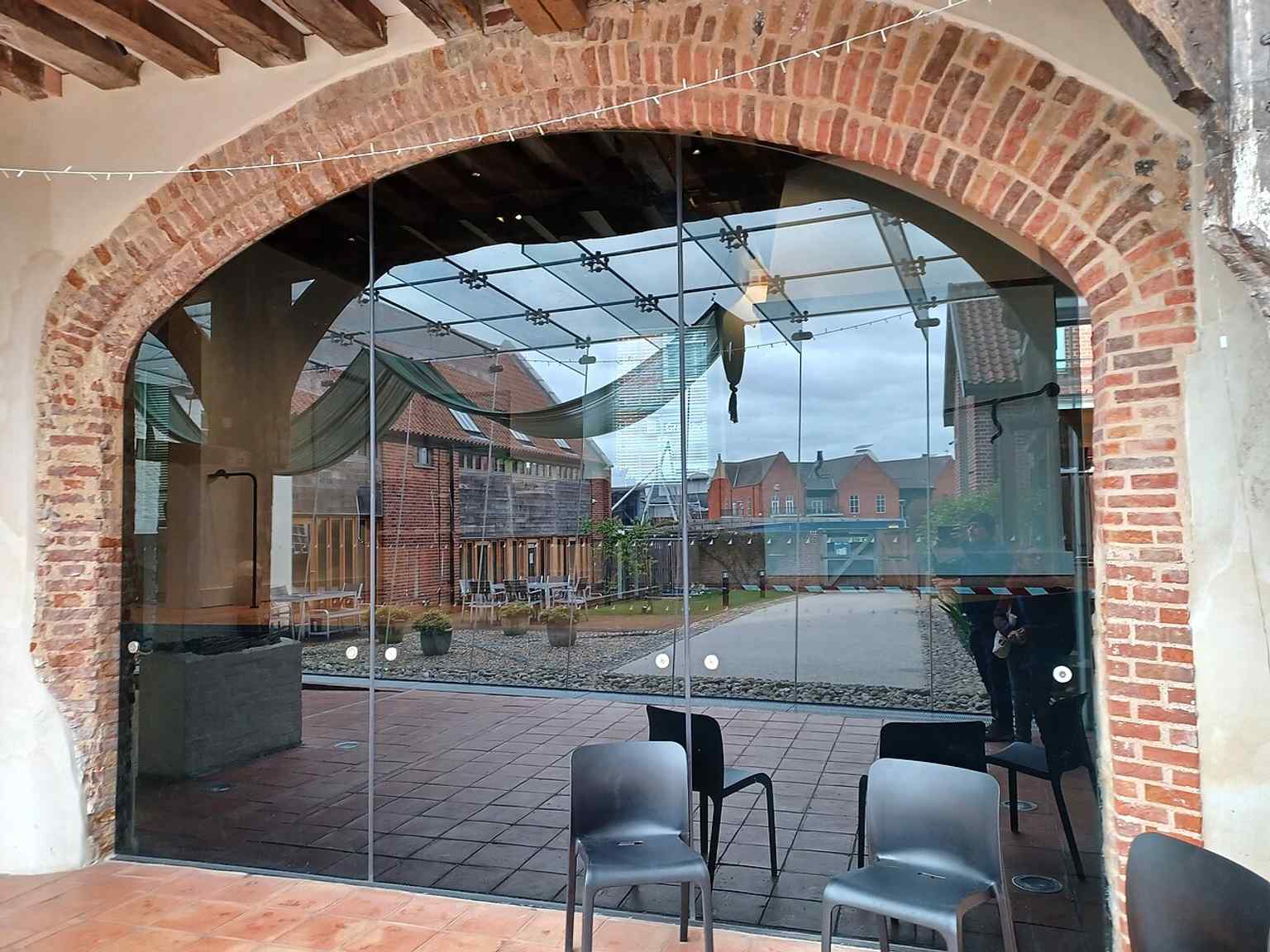 An interior view showing how the restored hall functions today as a cultural venue, while preserving its medieval merchant character.