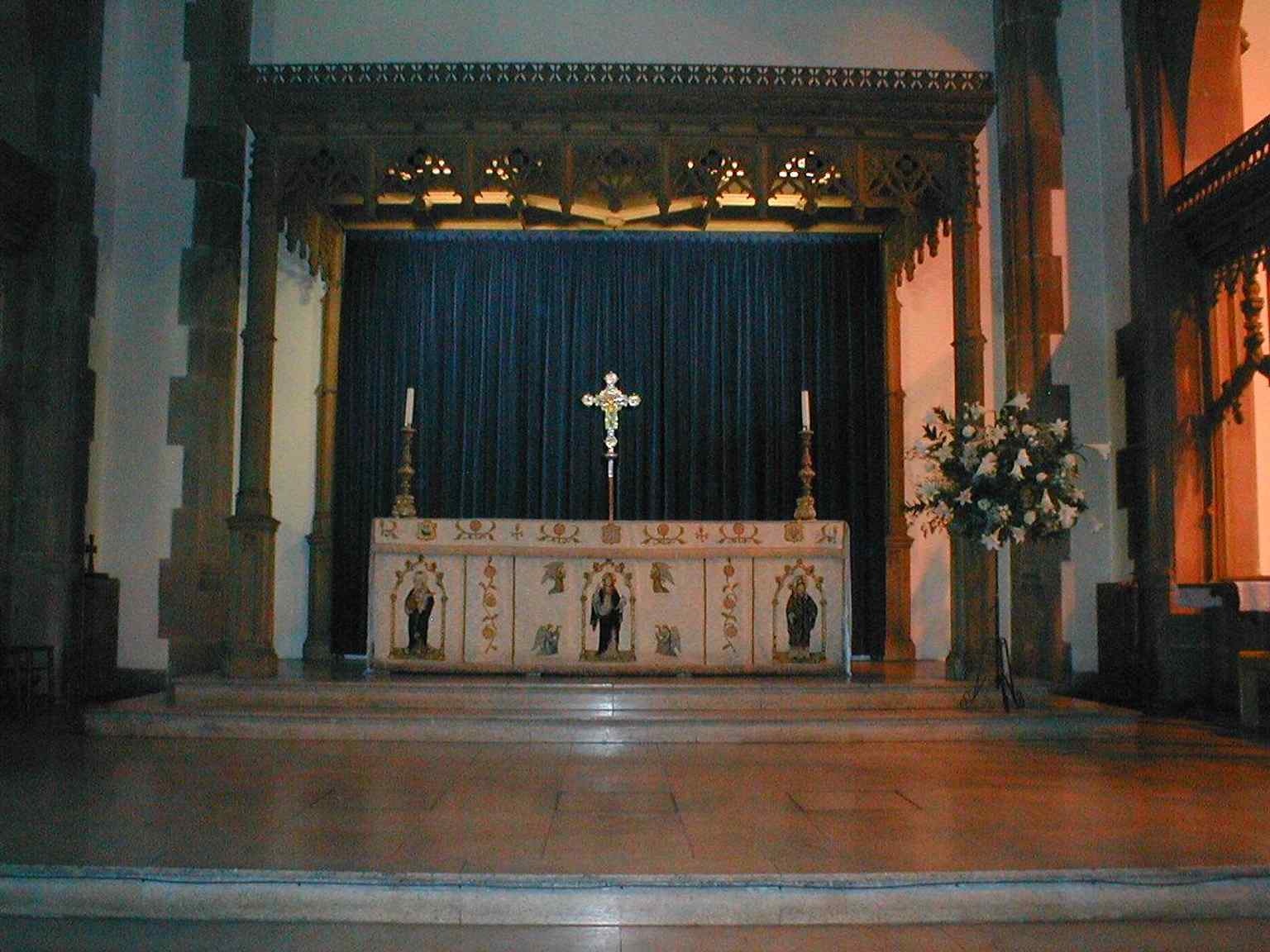 The altar inside the church, part of the living parish used today by dockside congregations and visitors alike.