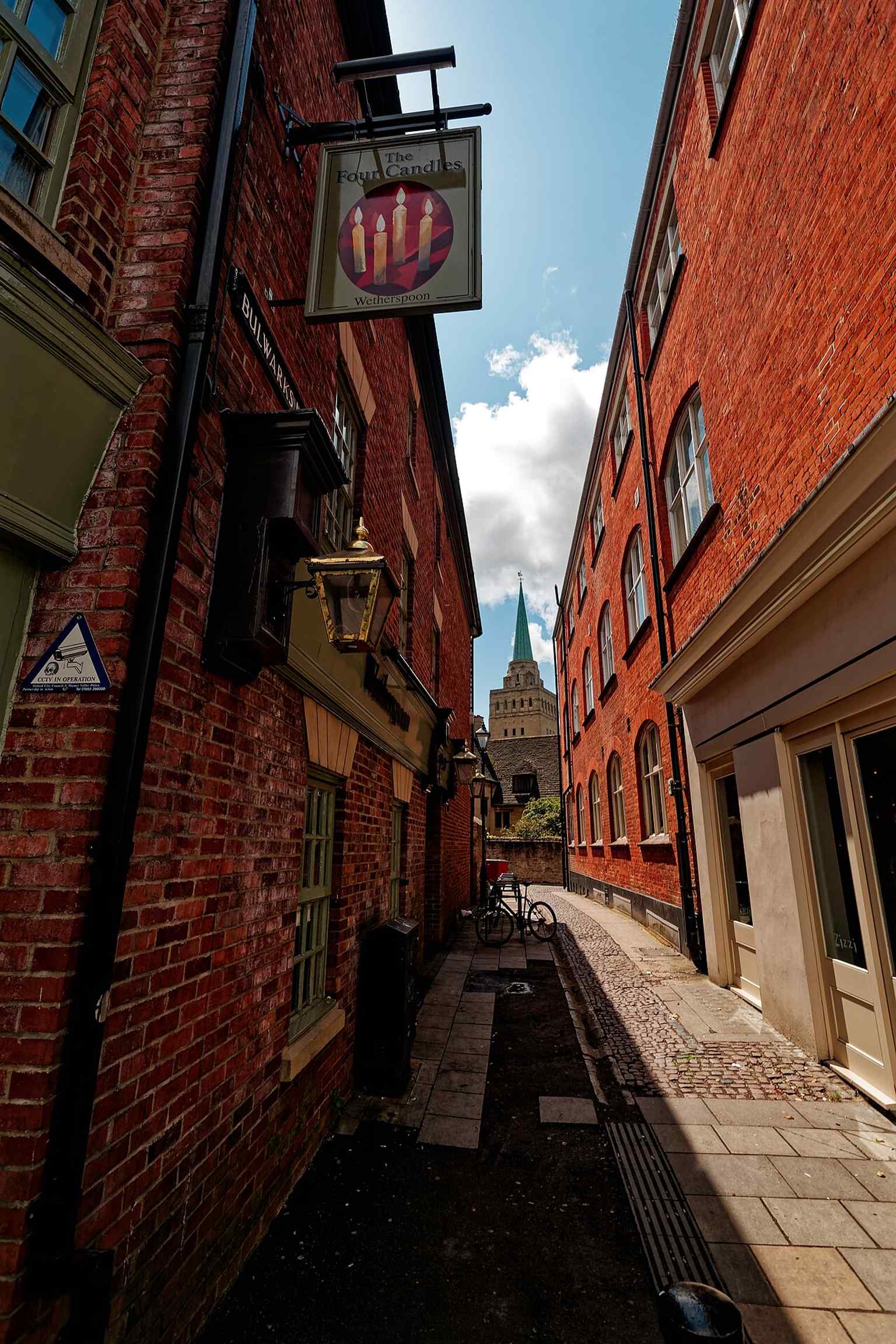 Looking south through Bulwarks Lane, this view links Nuffield College to Oxford’s west side and the rebuilt post-war streetscape.