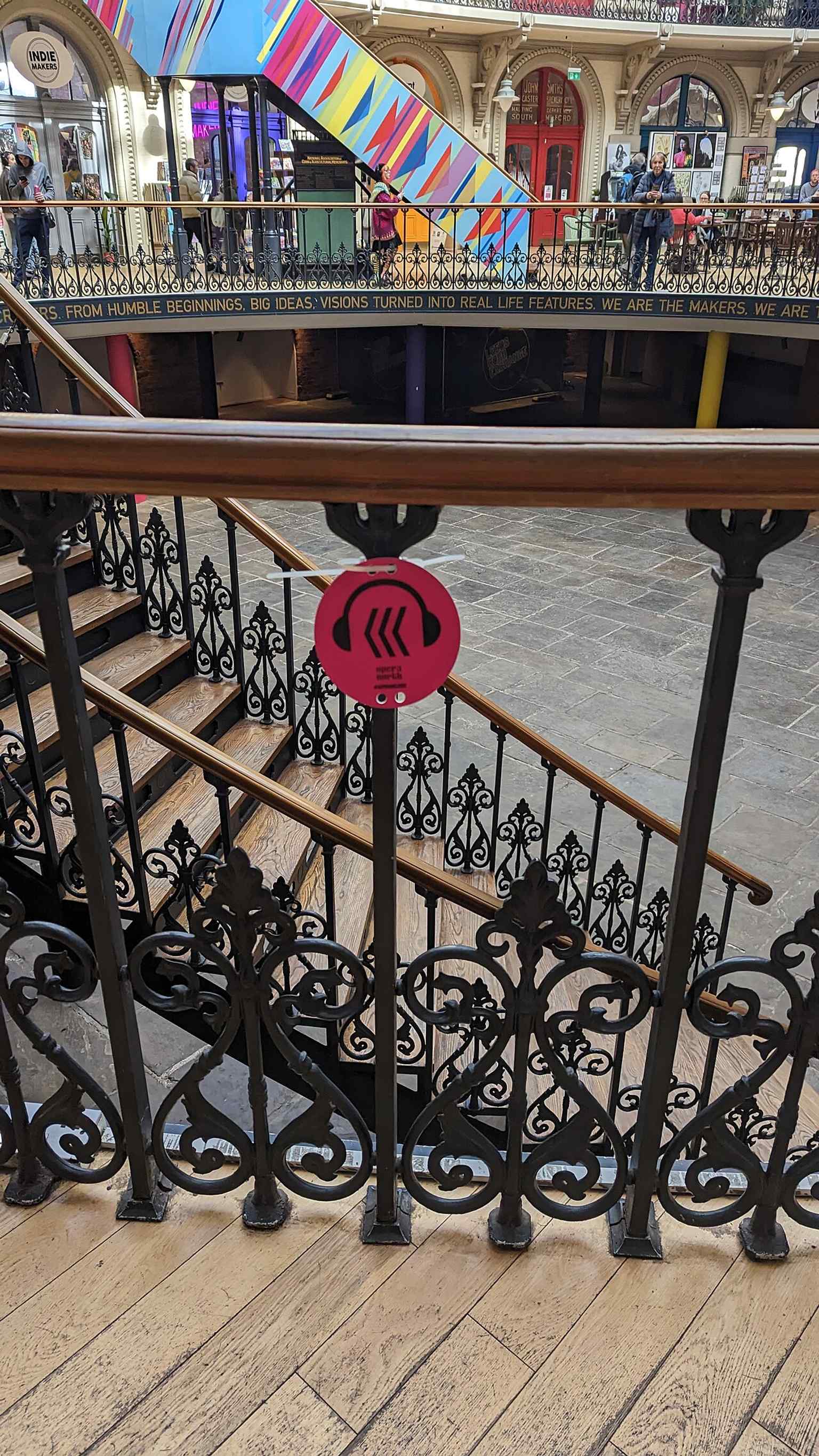 A contemporary audio-trail marker inside the Corn Exchange, showing the building’s current life as a cultural venue as well as a market hall.