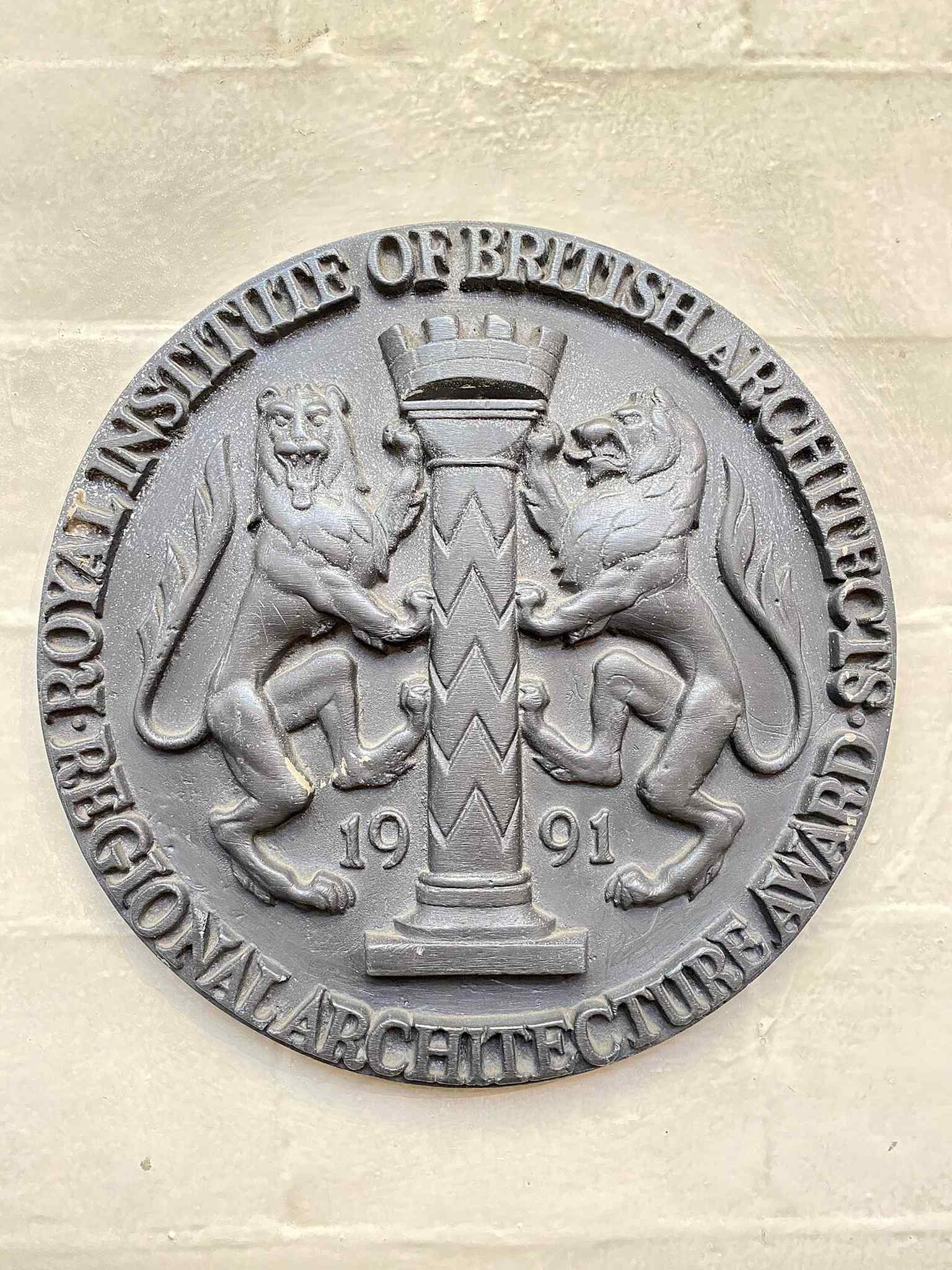 An architectural award plaque celebrating the restoration work that helped bring the Corn Exchange back into use.