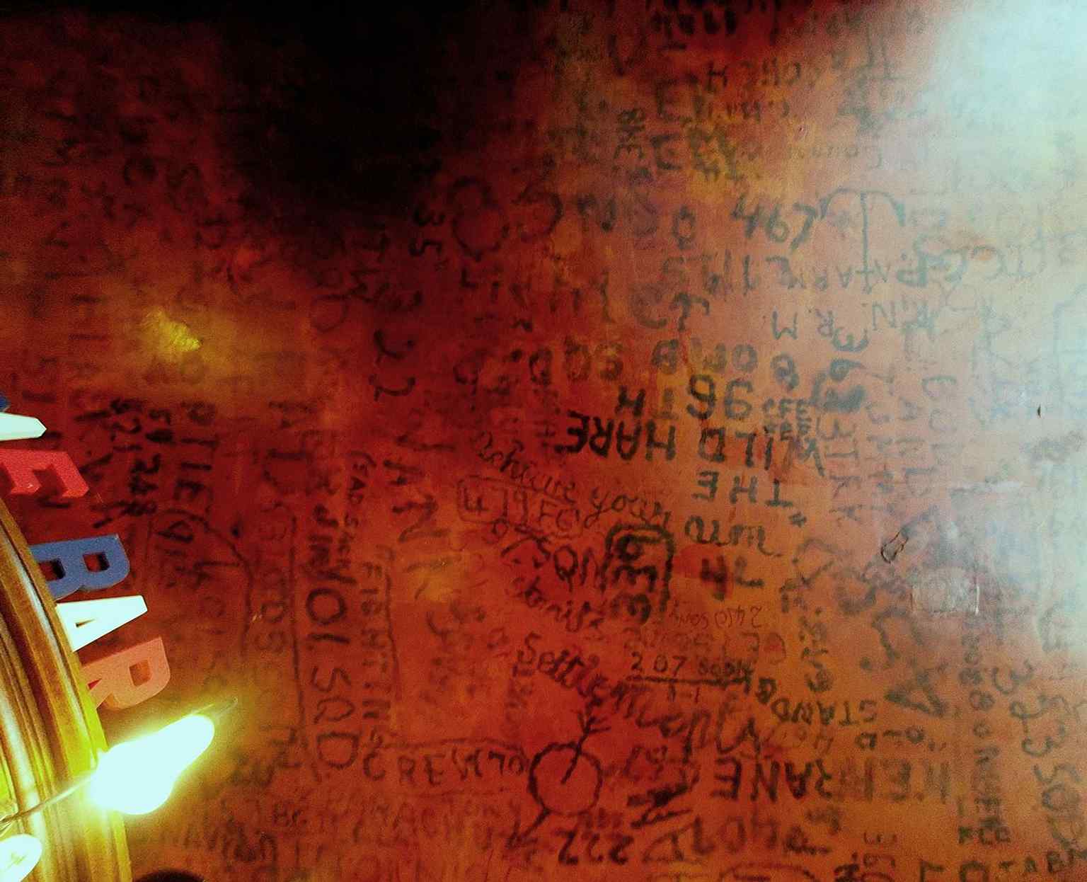 The RAF Bar ceiling covered in wartime graffiti, left by Allied airmen during the Second World War.