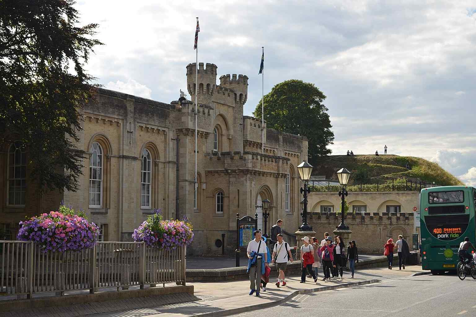 Oxford County Hall beside the castle mound on New Road — the 1840s building was designed to complement Oxford Castle with Norman-style crenellations.
