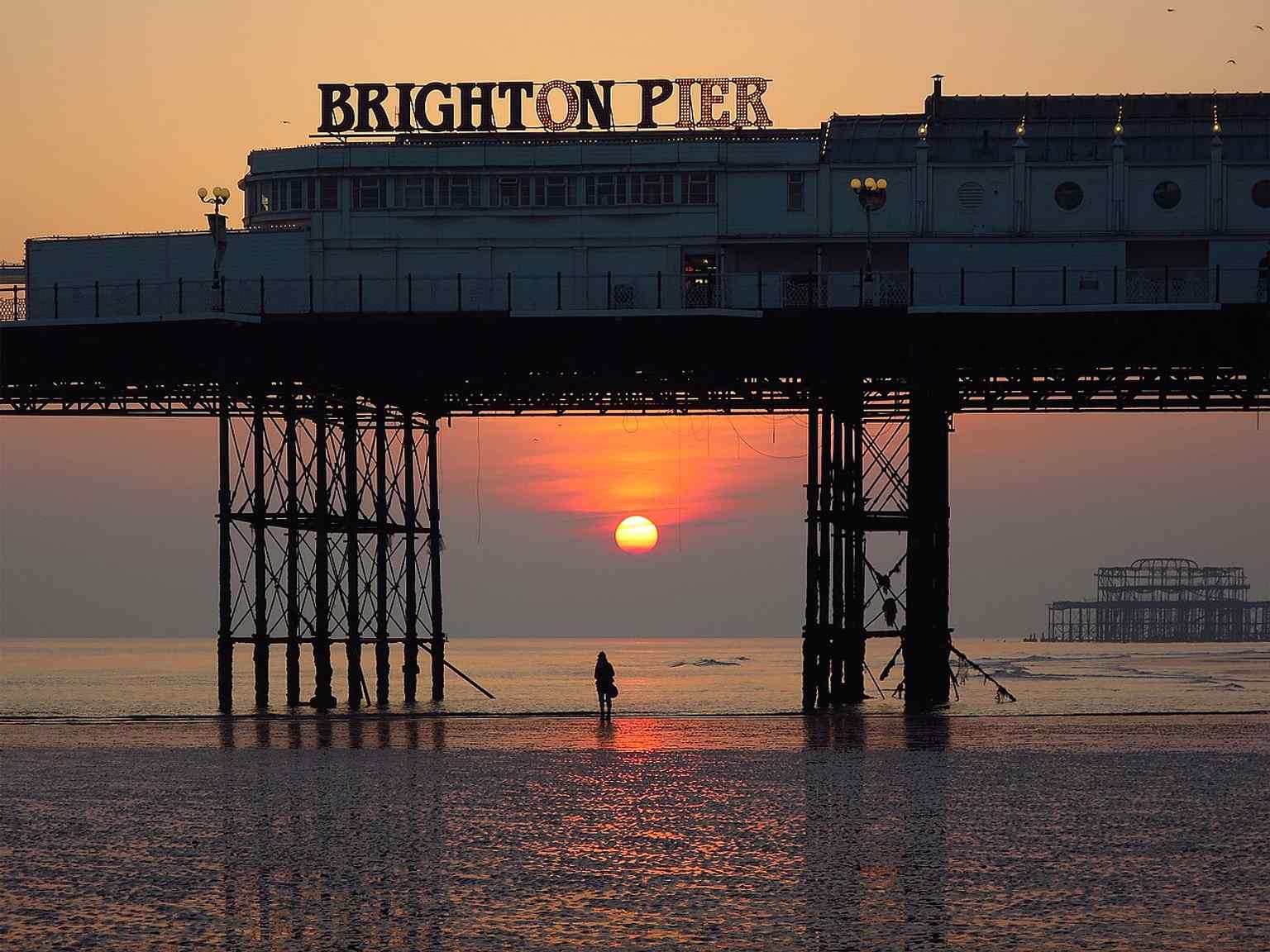 The Palace Pier in full daylight, a clear look at the Victorian-era structure that opened in 1899 and still draws millions of visitors.