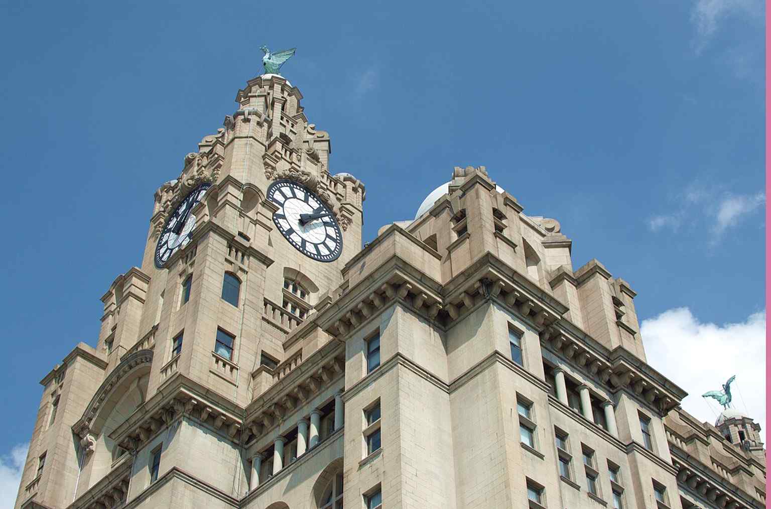 A classic full view of the Royal Liver Building on Liverpool’s waterfront, where it stands as one of the Three Graces at Pier Head.