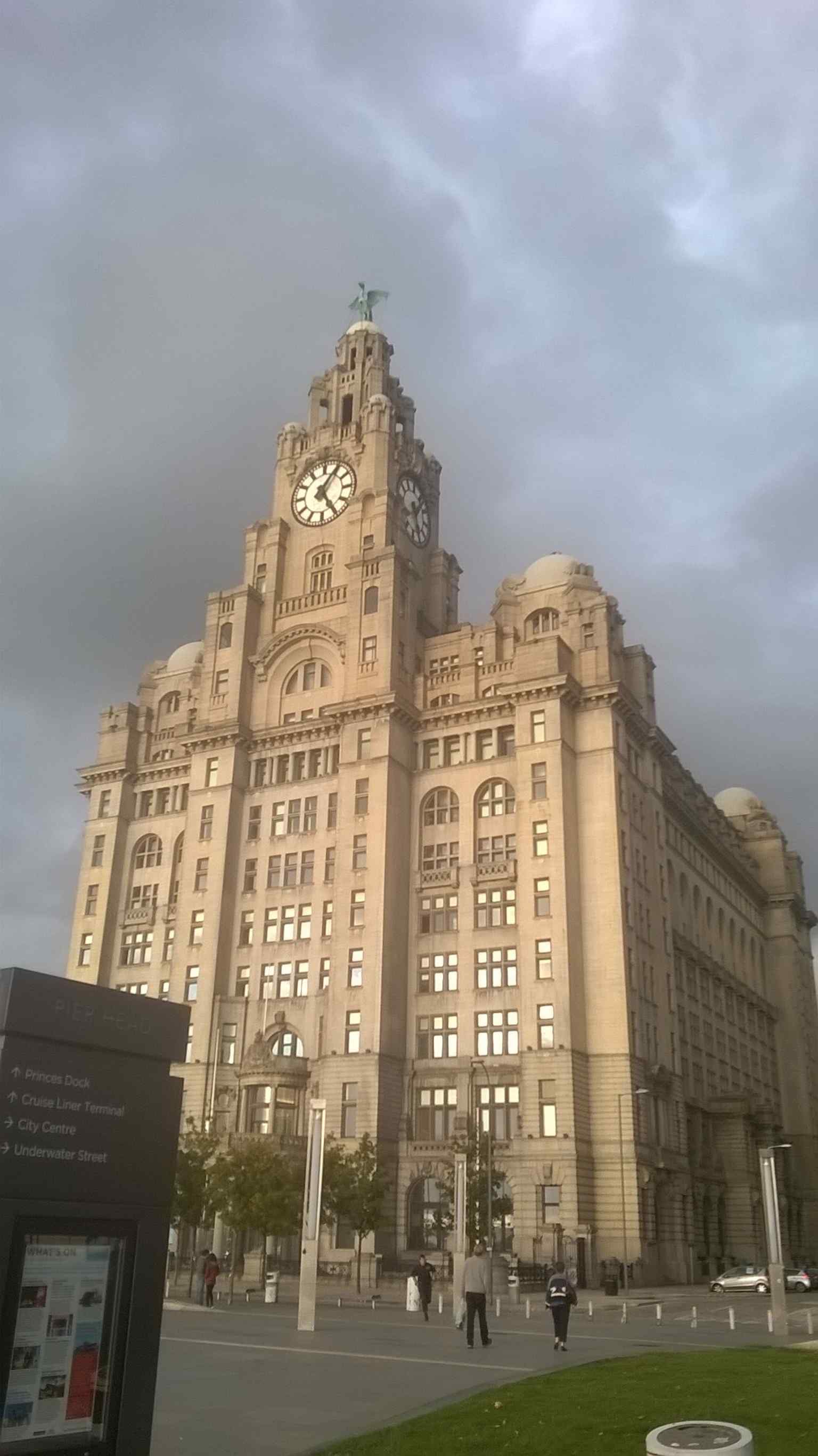 A front façade view that emphasizes the building’s monumental Edwardian Baroque design and imposing clock towers.