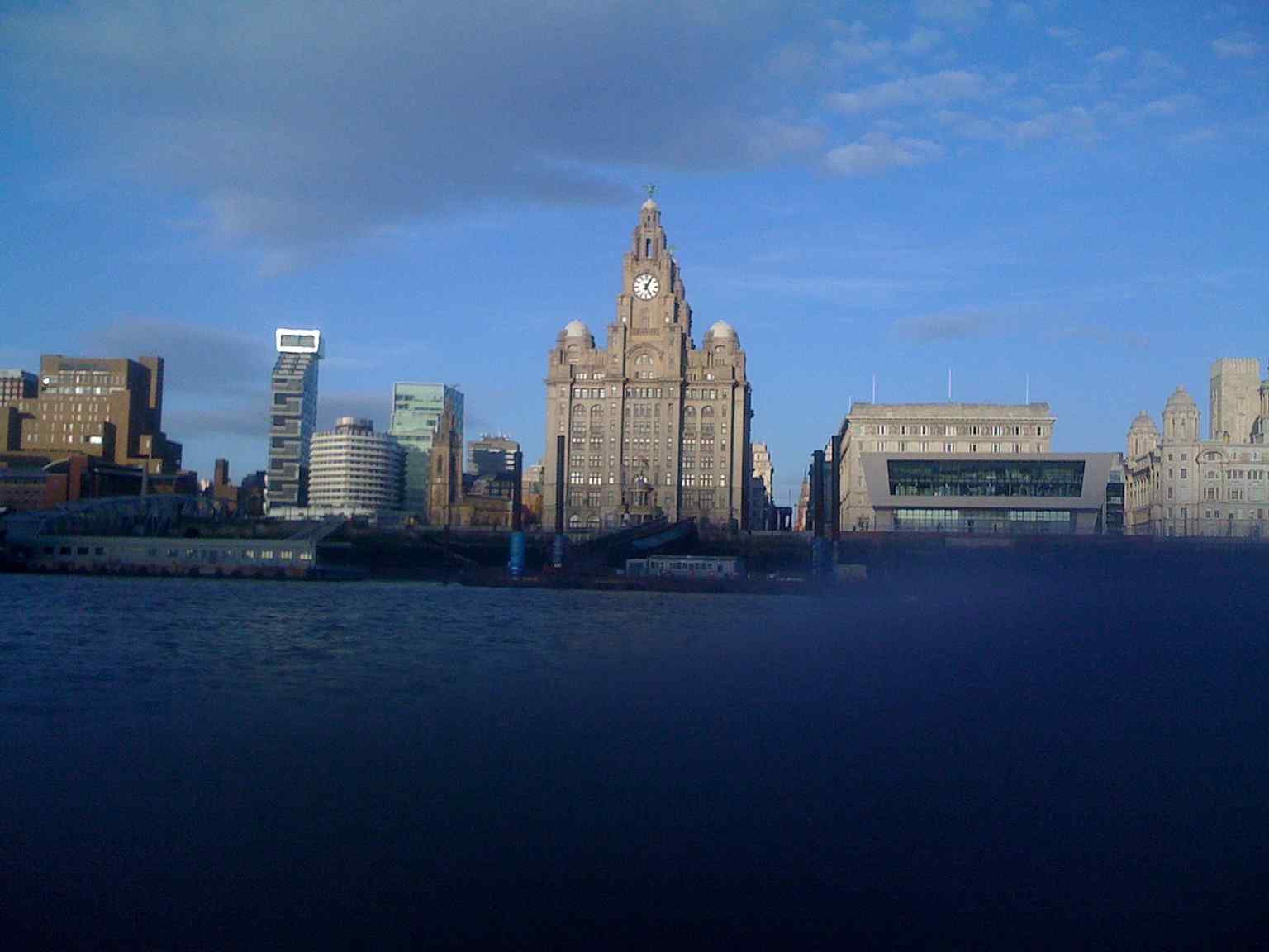 The Royal Liver Building from the Mersey, echoing the way generations have approached Liverpool by river and seen the landmark first.