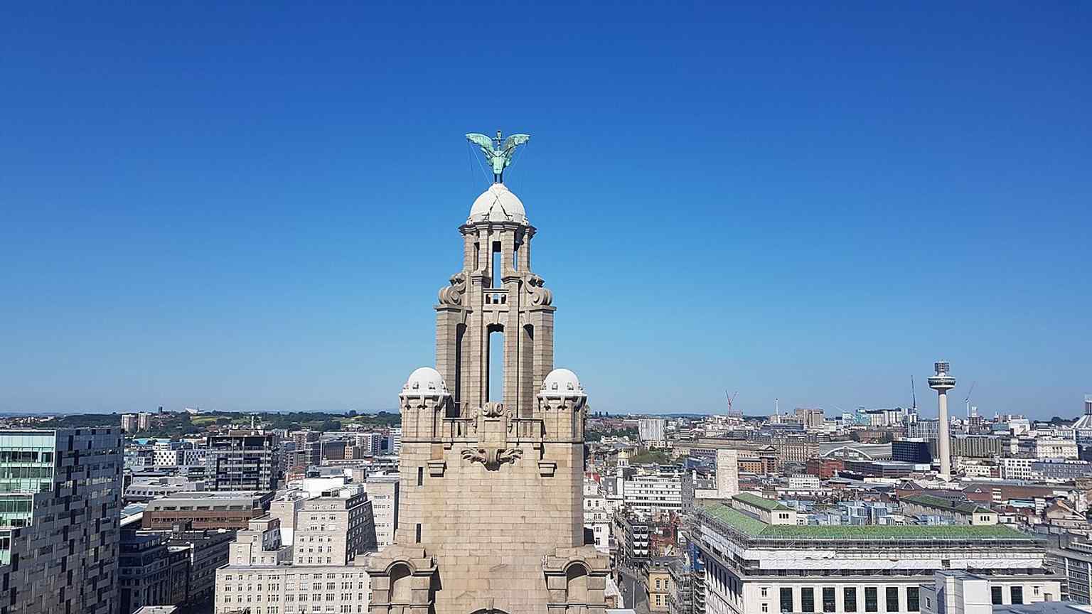 Close on the East Clock Tower and one of the famous Liver birds — the bronze guardians that watch over the city and the sea.