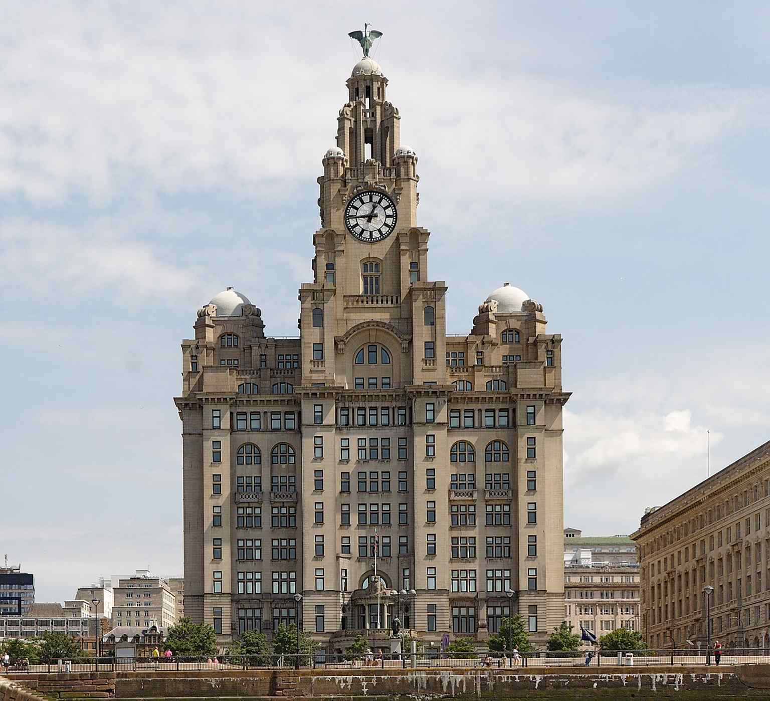 A ferry-side view that places the Liver Building in the working waterfront context that helped make Liverpool a global port city.