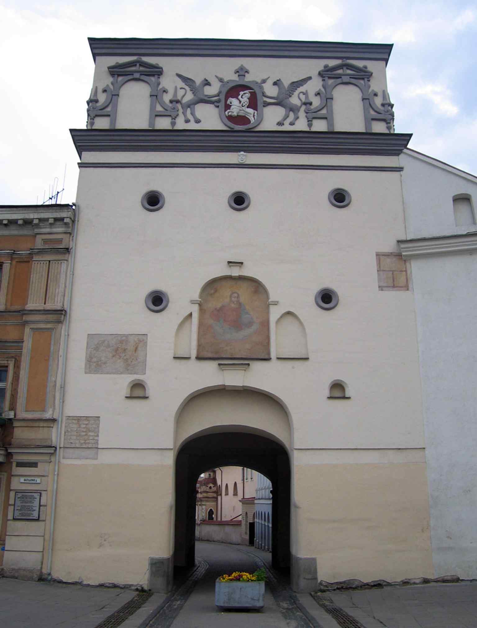 The outside of the gate shows its defensive character, with the city-gate opening and historic fortification details still visible.