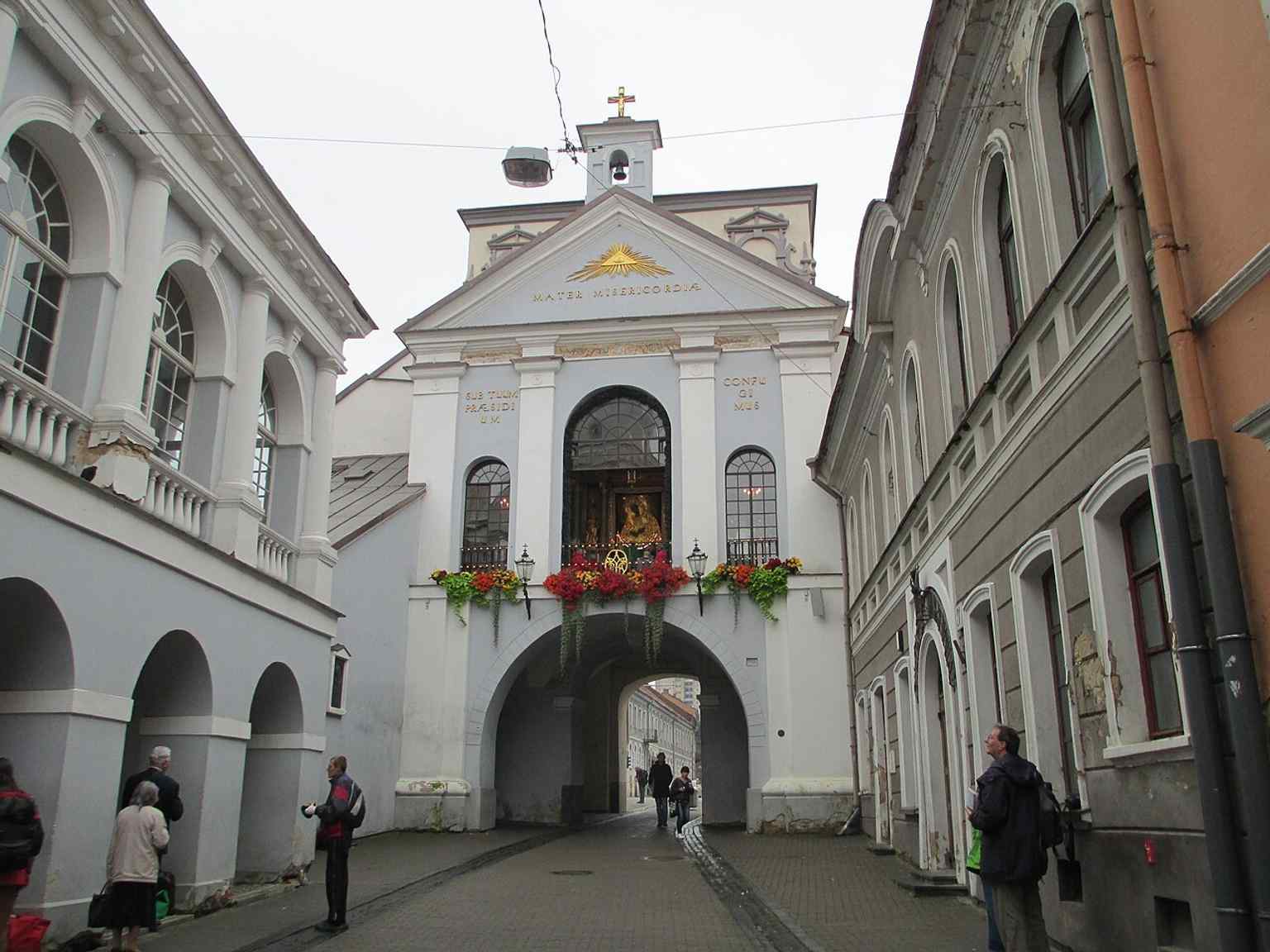 The interior passage of the gate, showing the chapel space tucked within the arch and the narrow devotional setting.