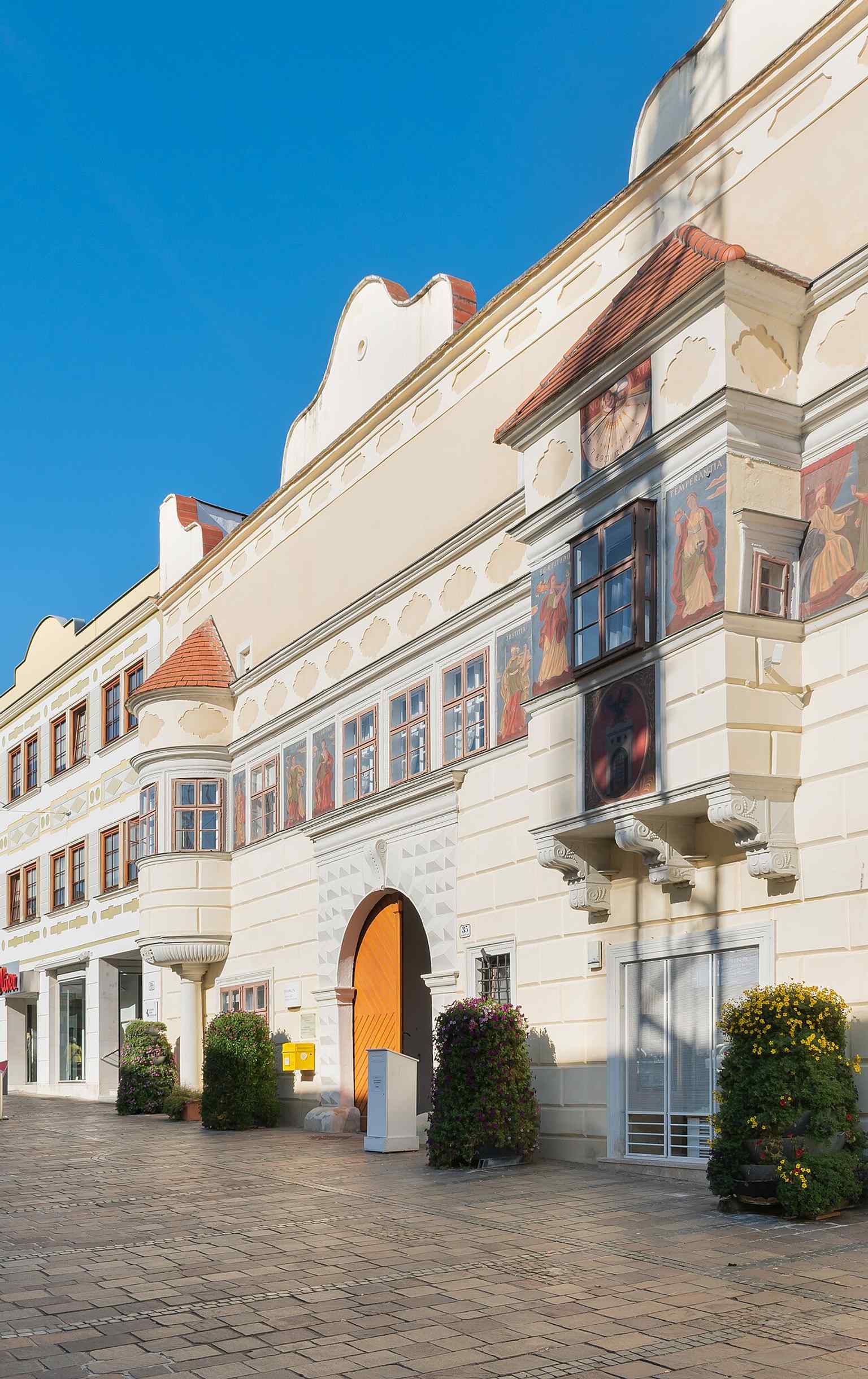 The street facade of Eisenstadt Town Hall, whose historic exterior once carried virtue figures and biblical scenes as a moral program for the city.