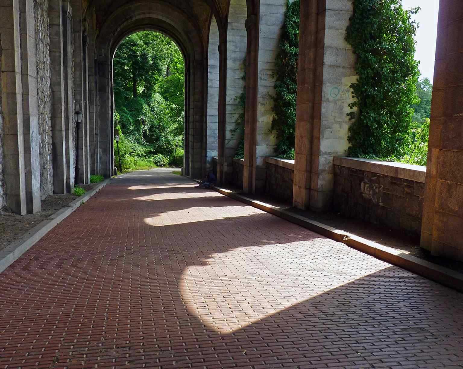 The Billings Road arches show how the former estate driveway was folded into the park’s path system.