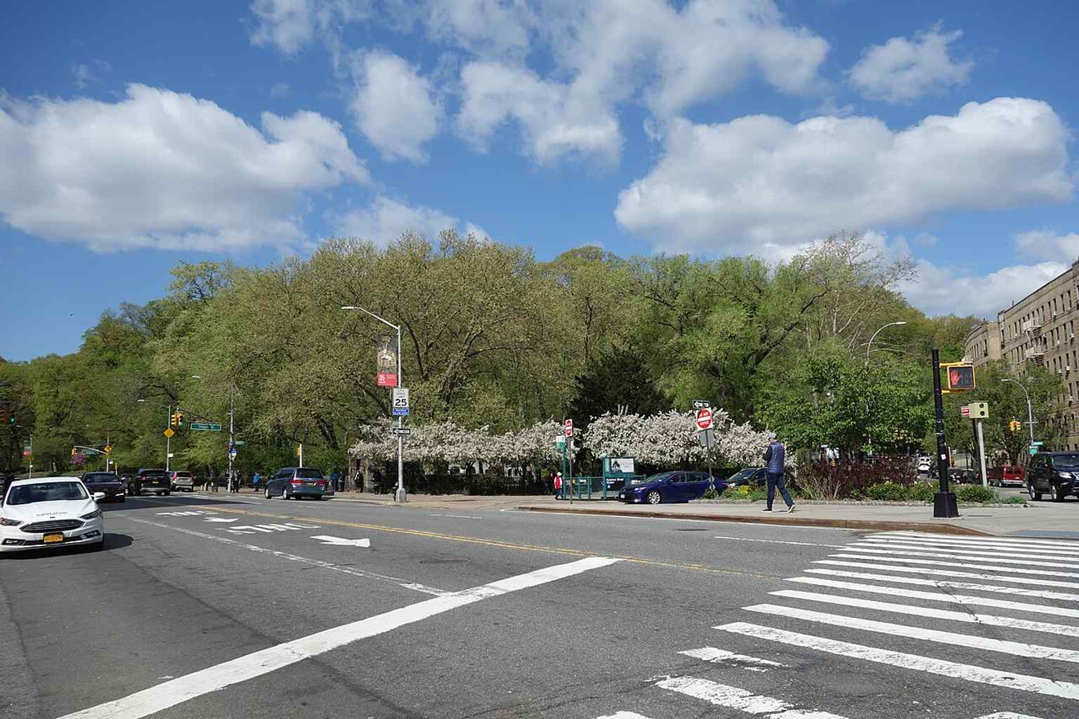 A wide look at the park’s northern tip by Dyckman Street, where Fort Tryon meets Inwood and the subway entrance sits at the edge.