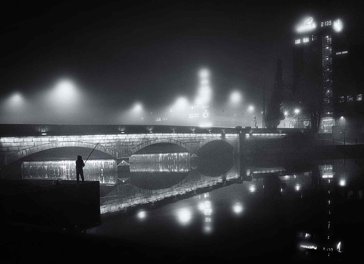 A foggy modern view of Pitkäsilta, showing how the bridge still marks the historic boundary often associated with Helsinki’s political divide.