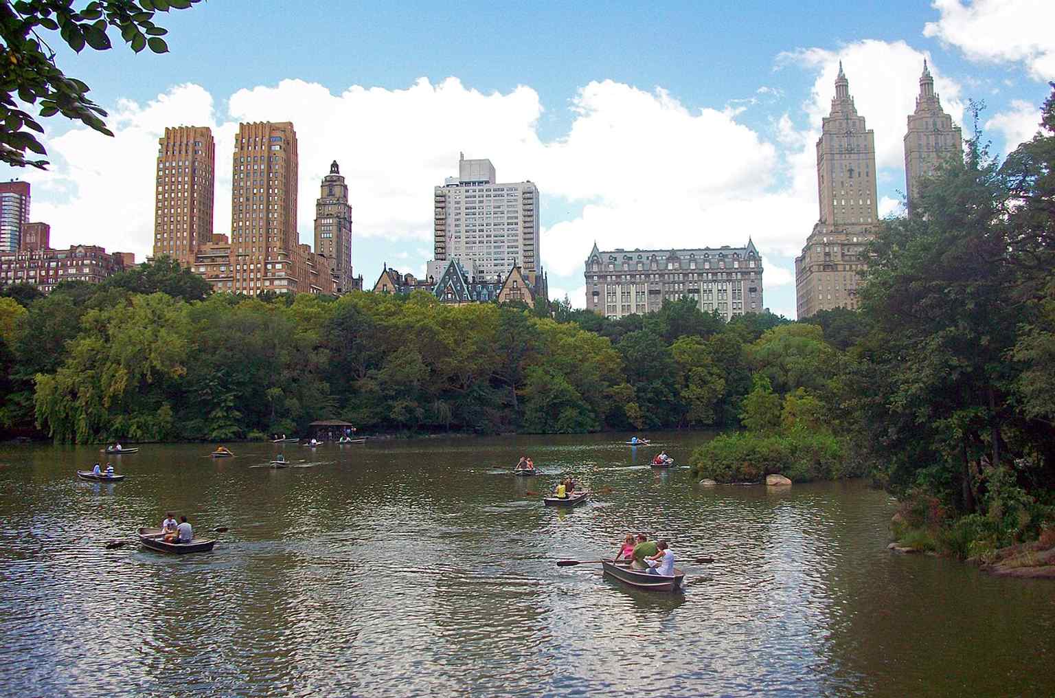From across the Lake in Central Park, the Dakota, Langham, Majestic, and San Remo line up as part of the district’s famous skyline of luxury apartment houses.