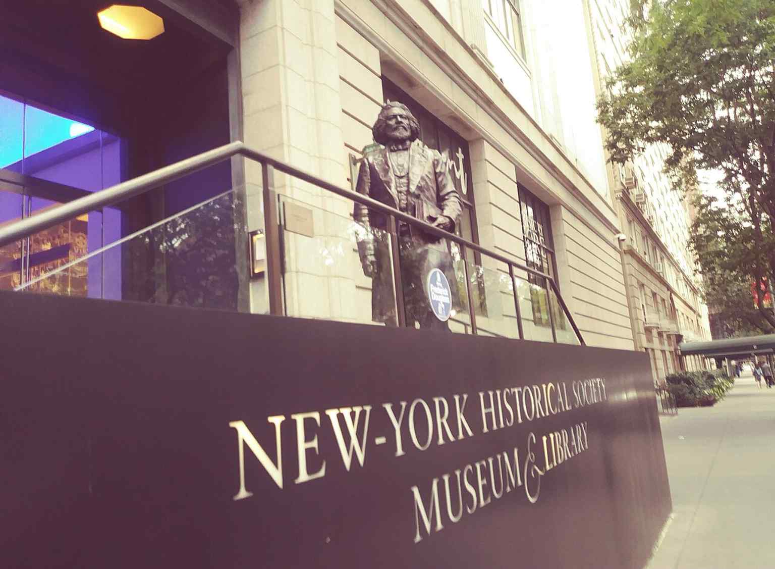 Frederick Douglass stands at the New-York Historical Society, one of the district’s key institutional landmarks beside Central Park West.