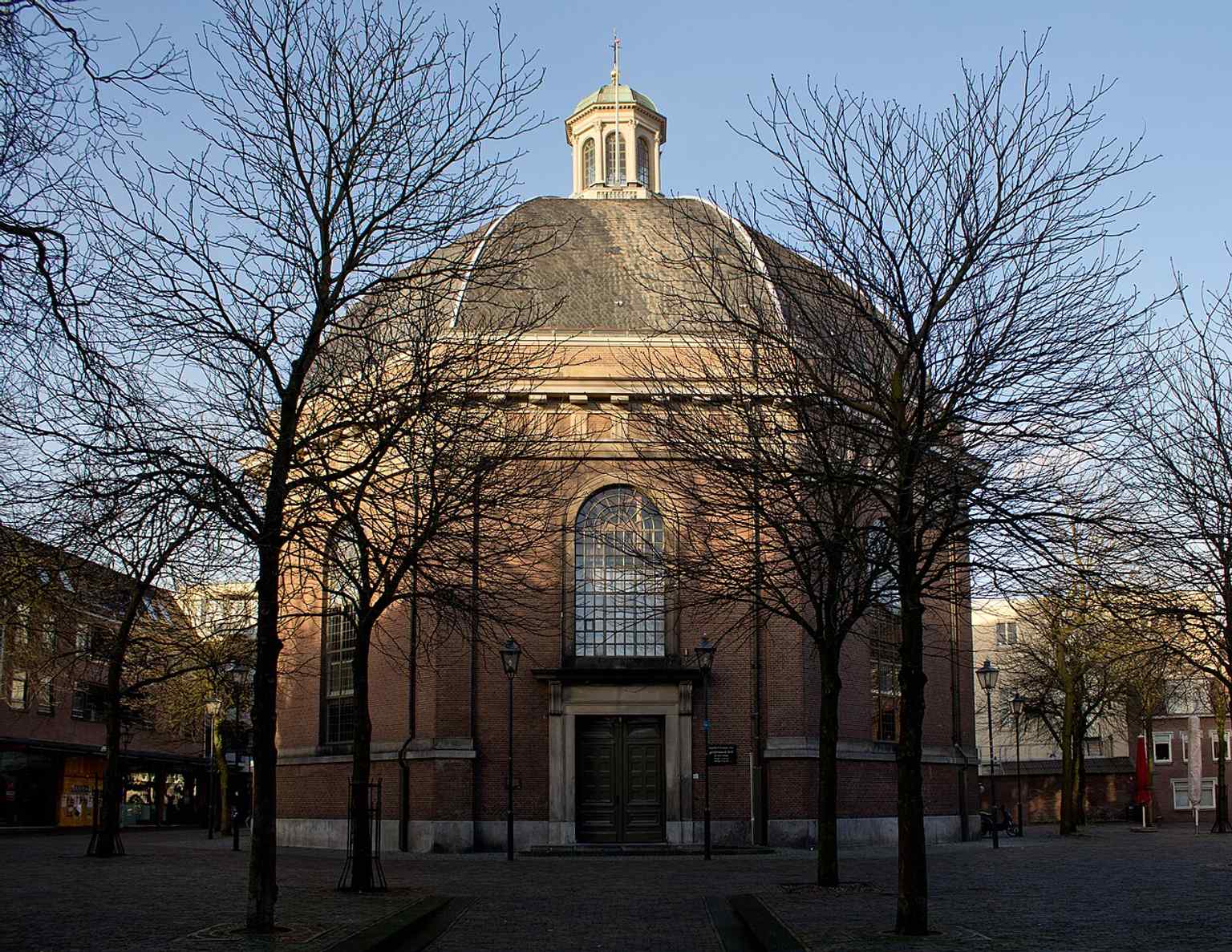 A modern high-resolution exterior shot that shows the Koepelkerk today, continuing its role as both worship space and Arnhem landmark.
