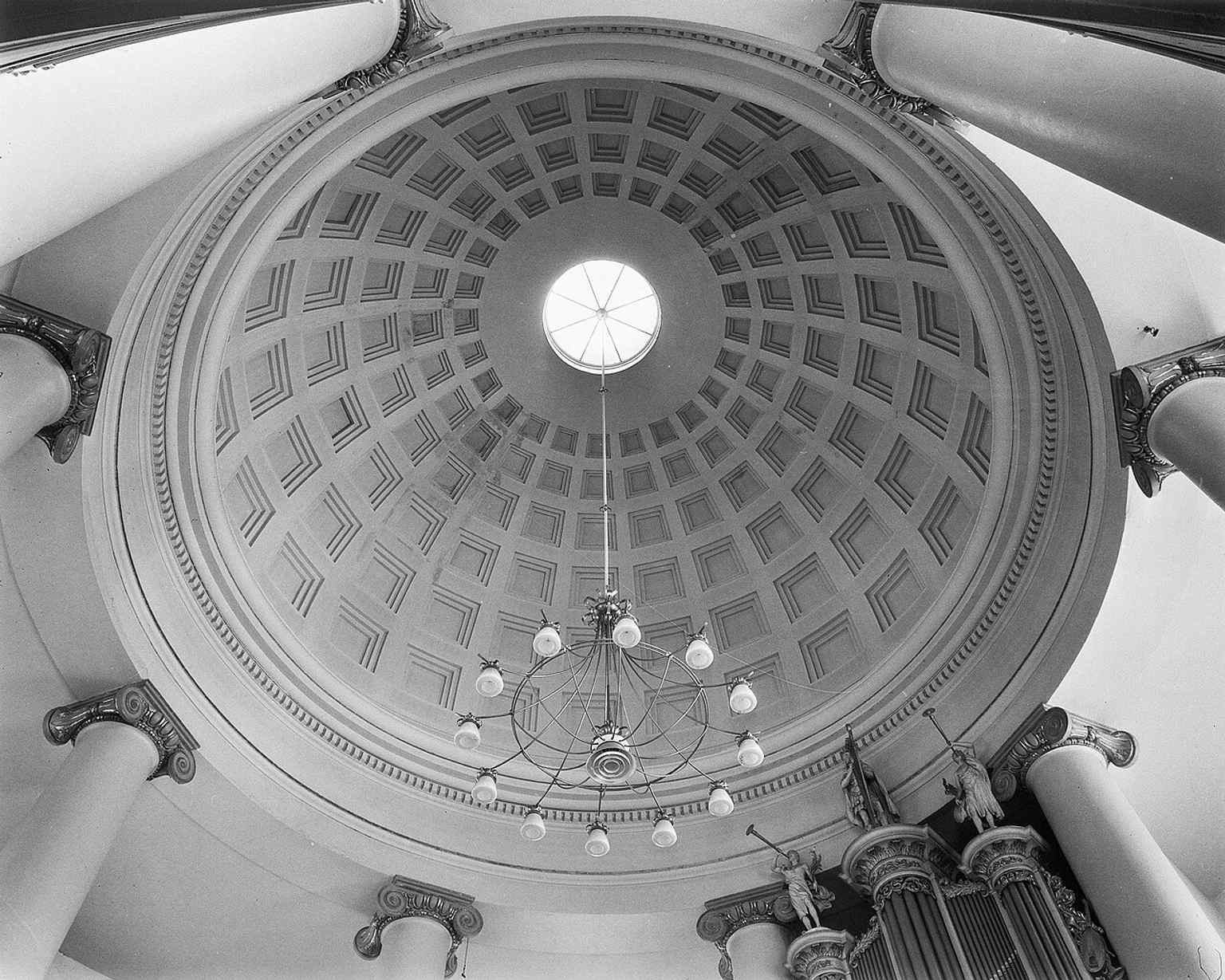 Inside the dome, the 144 cassettes make the architecture feel lighter than it looks from outside, a signature feature of the church.