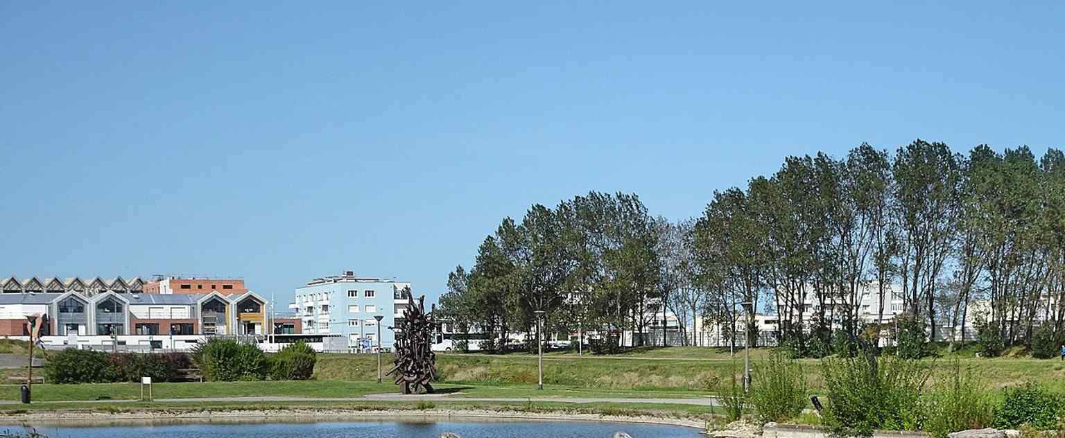A broad view of the LAAC site in Dunkirk, showing the museum set within its sculpture garden and landscaped surroundings.
