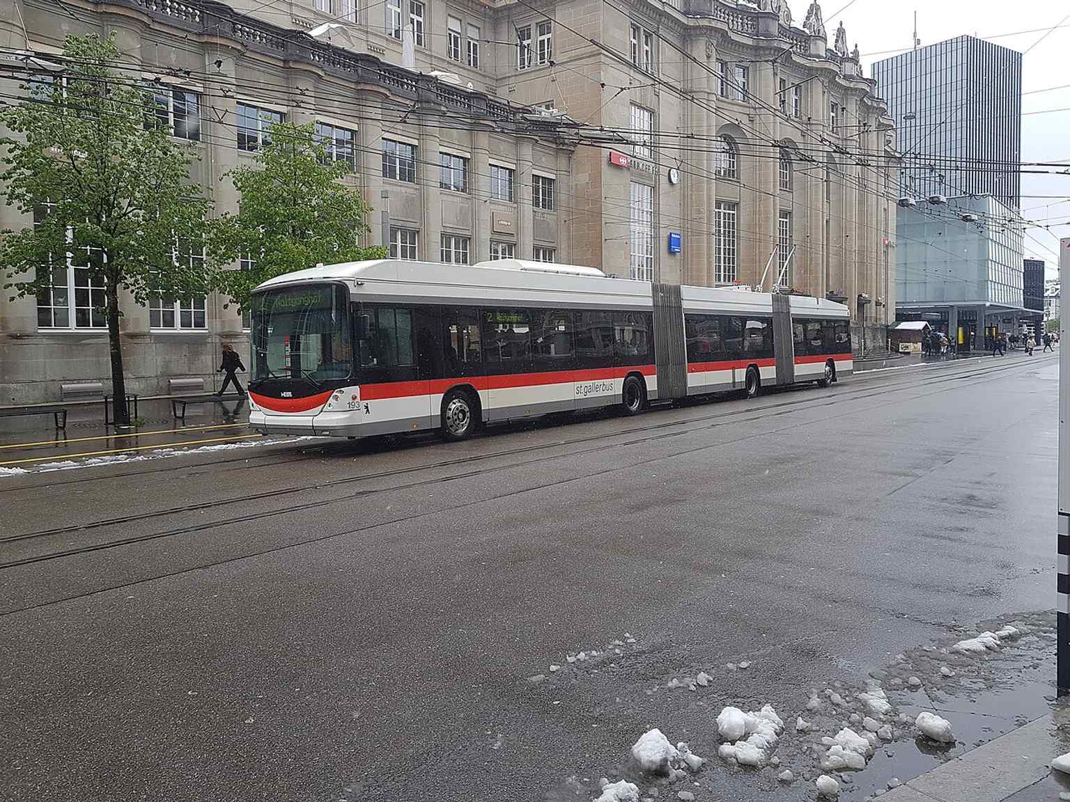 A modern VBSG trolleybus at Bahnhof St. Gallen — public transport remains central to everyday city life.