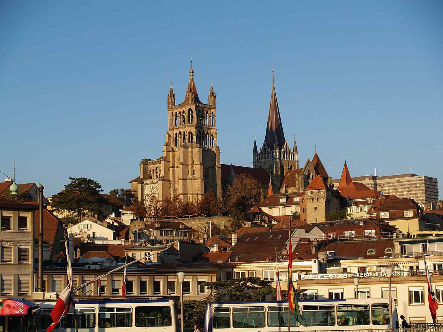 Seen from the Grand-Pont, this wider city view places Notre-Dame in Lausanne’s historic skyline and hints at its role above the old town.