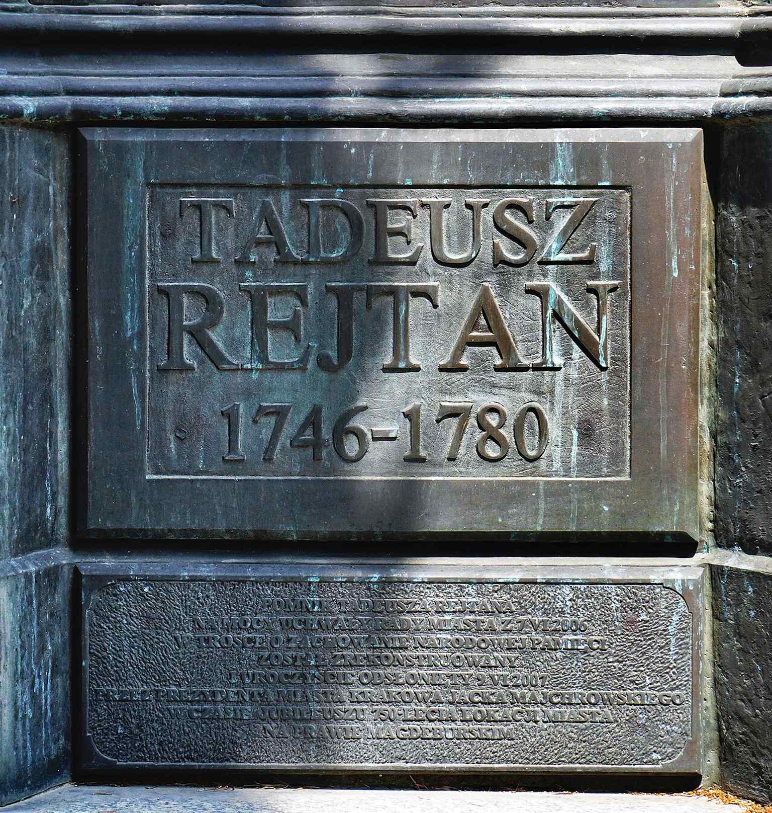The commemorative plaque for the monument site — a useful contextual detail for the story of the 1890 unveiling, wartime loss, and 2007 rebirth.