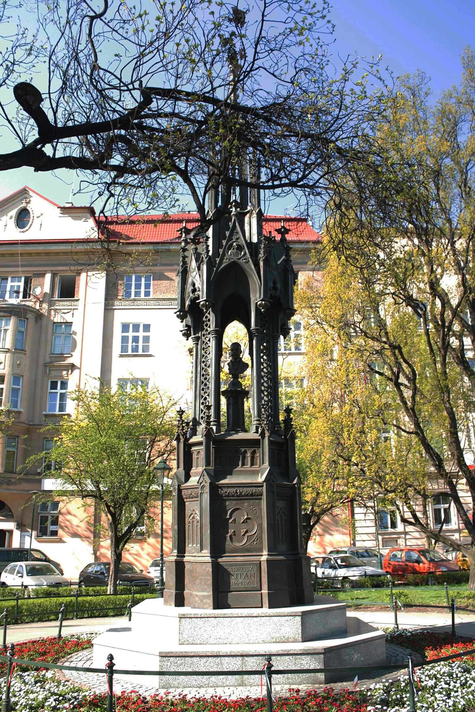 A clear full view of the reconstructed monument standing on the square, matching the tour’s story of the 2007 return of Rejtan to Kraków.