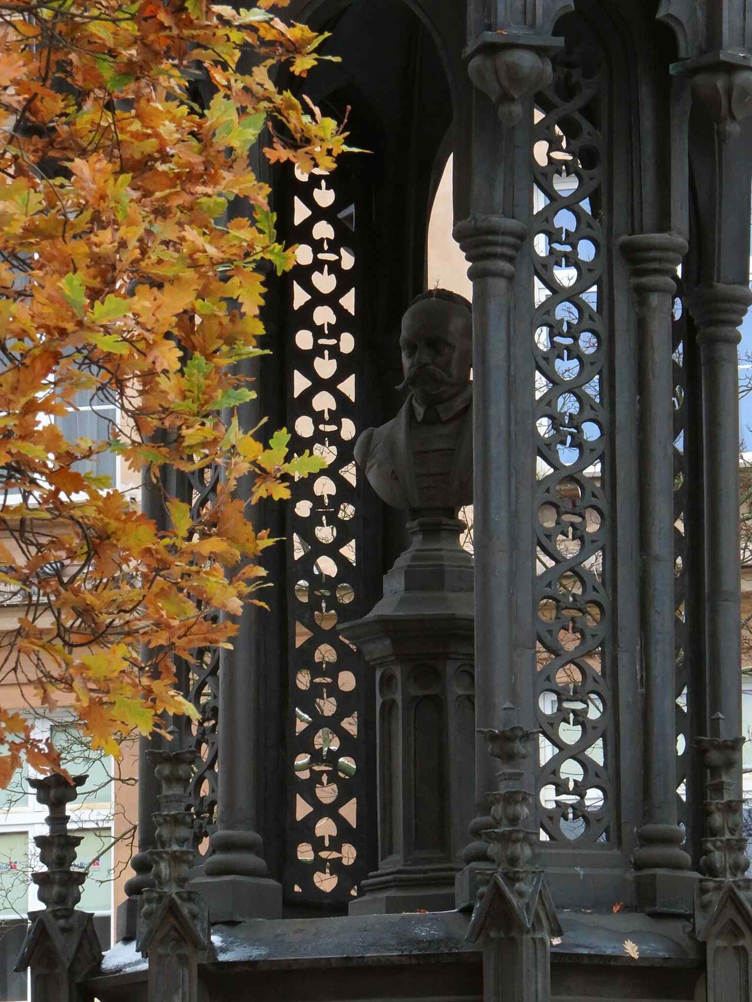 A closer angle that helps reveal the ornate neo-Gothic structure and the bust inside — the part preserved in the National Museum after the 1946 storm damage.