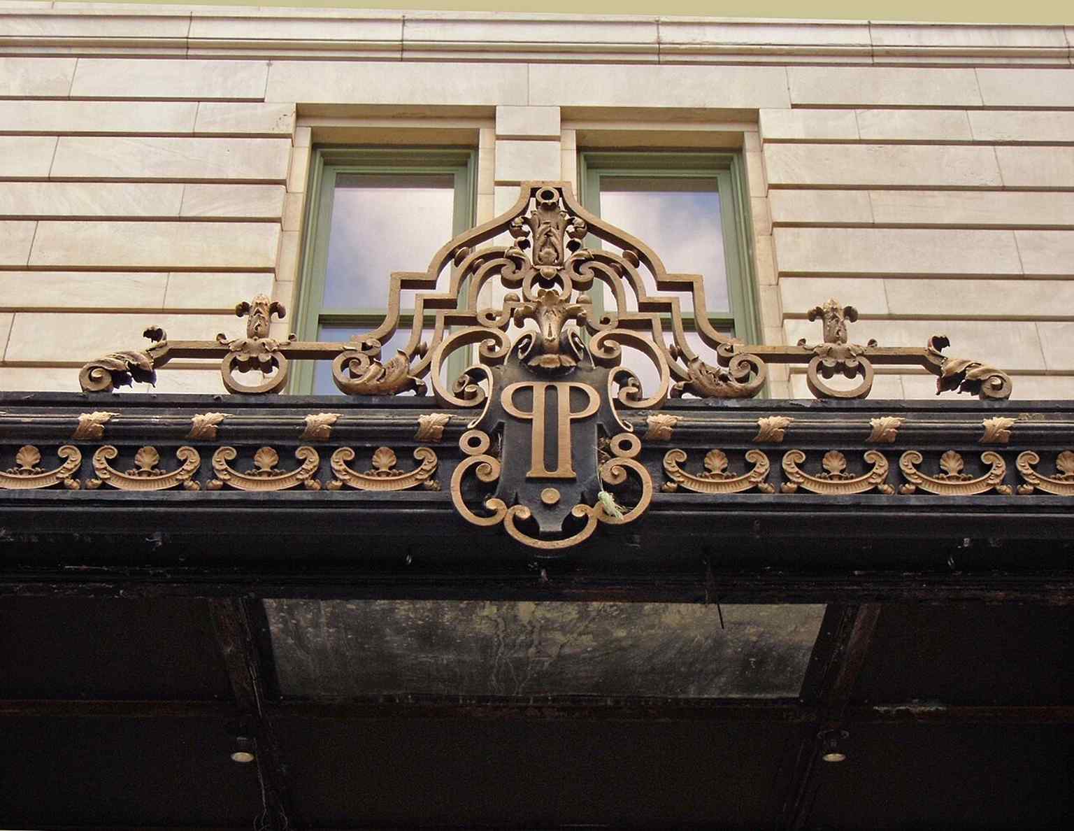 A close-up of the Plaza logo canopy at the 59th Street entrance—an unmistakable detail of the hotel’s branded, upscale identity.