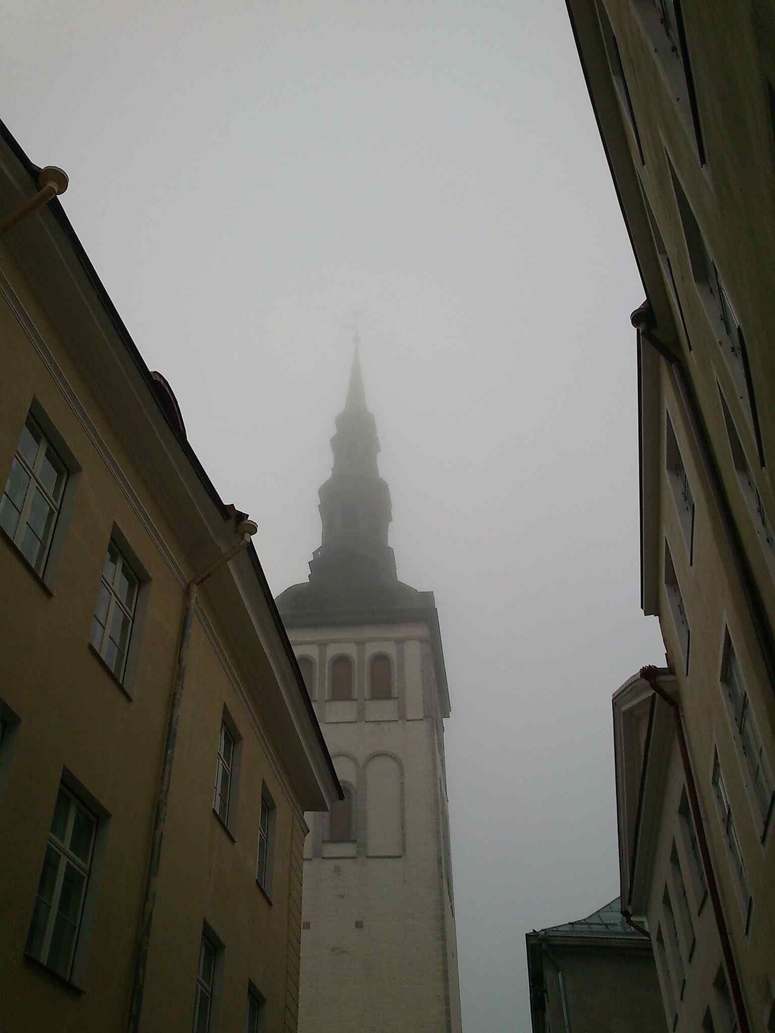 Niguliste shrouded in mist in 2013, a moody reminder of the long restoration history after wartime destruction.