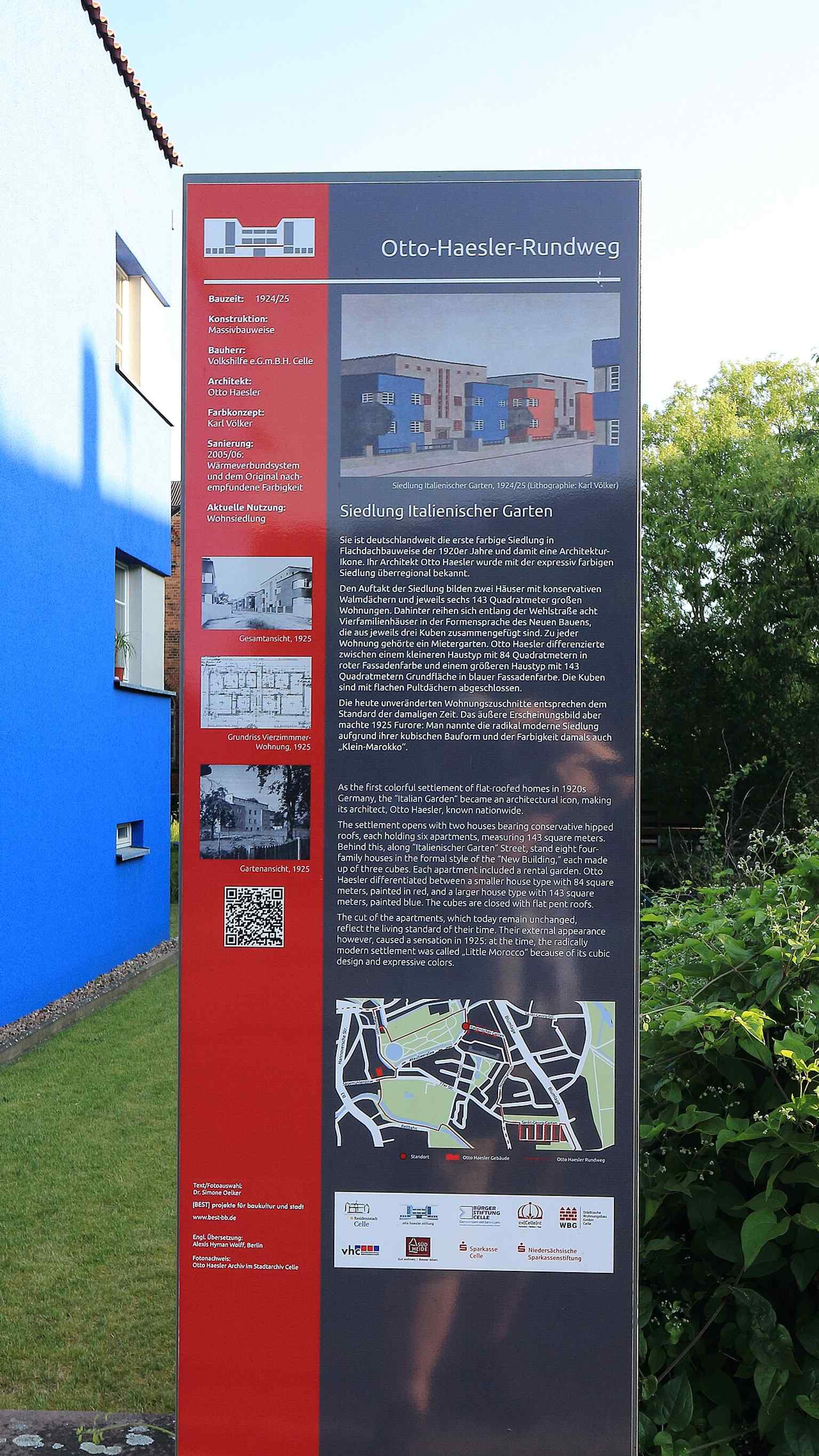 An information sign about the 'Italian Garden' settlement by Otto Haesler, providing historical context and details about this significant architectural landmark.