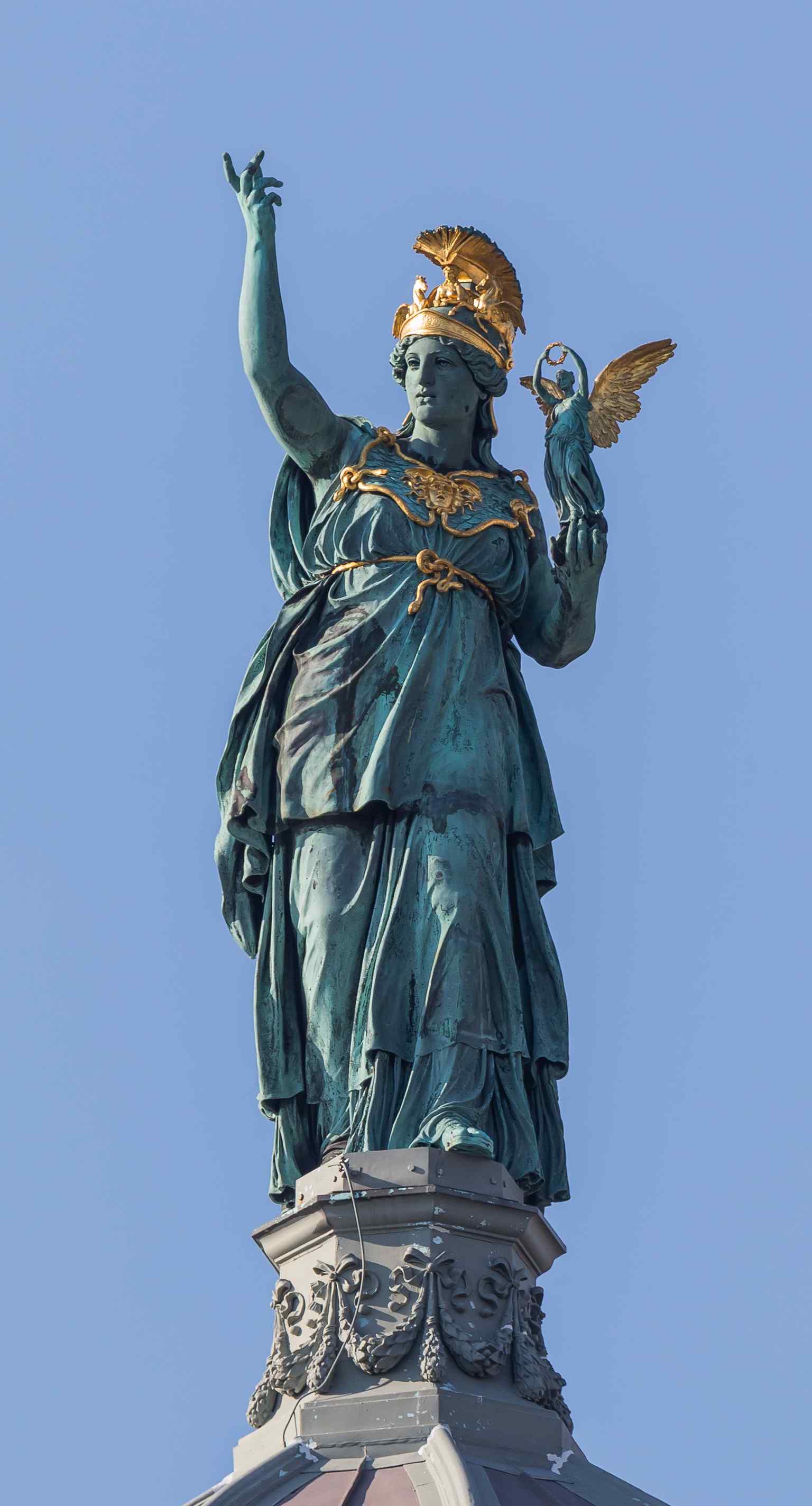 The striking bronze statue of Pallas Athene by Johannes Benk, crowning the dome and symbolizing the museum's dedication to arts and sciences.