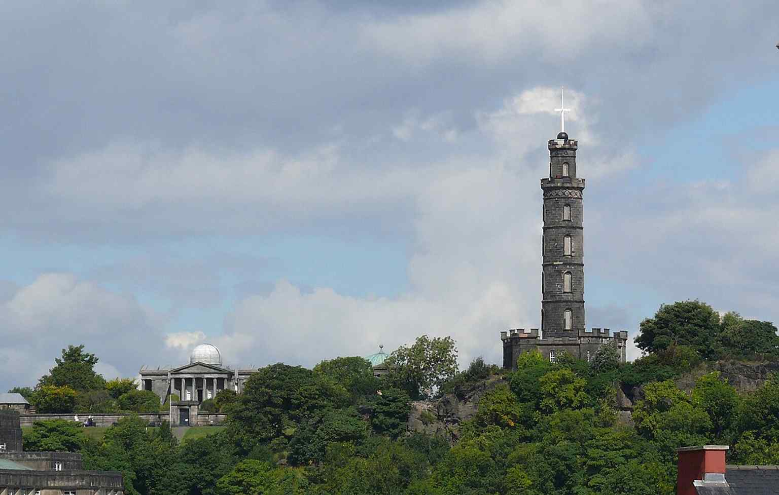 Calton Hill with the monument beside the City Observatory, linking Nelson’s tower to the hill’s wider scientific landscape.