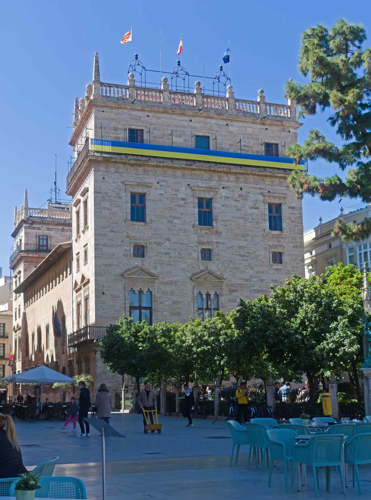 The imposing exterior of the Palace of the Generalitat Valenciana, featuring its classic arched entryway and stone towers (2022).