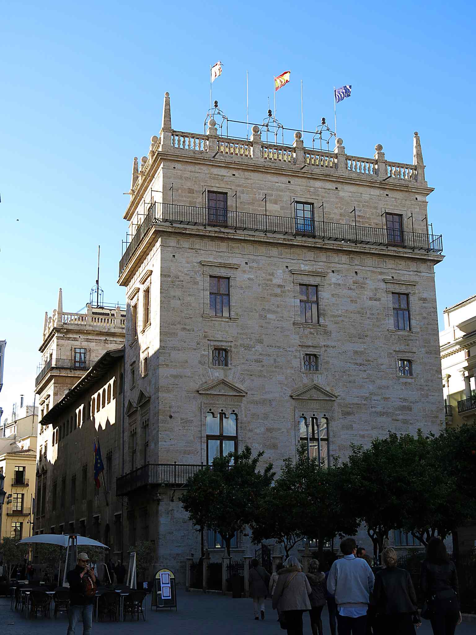 The original eastern tower standing proudly over the bustling plaza, a testament to centuries of civic history (2016).