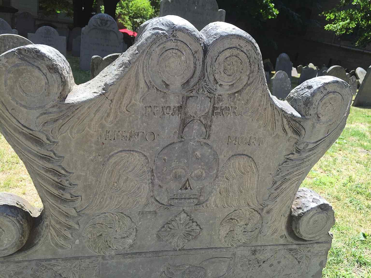 A grave marker in the adjacent King's Chapel Burying Ground, which predates the present church by more than a century and is not part of the congregation.