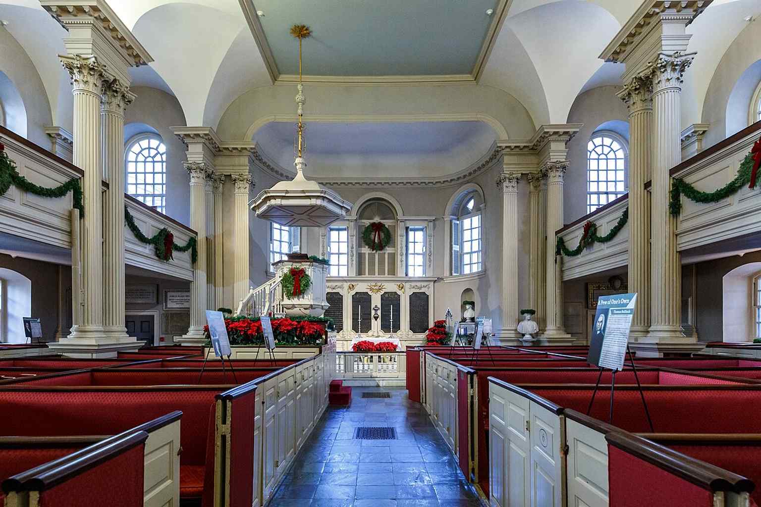 A look toward the pulpit inside King's Chapel, where the old pulpit and altar pieces recall the earlier wooden church.