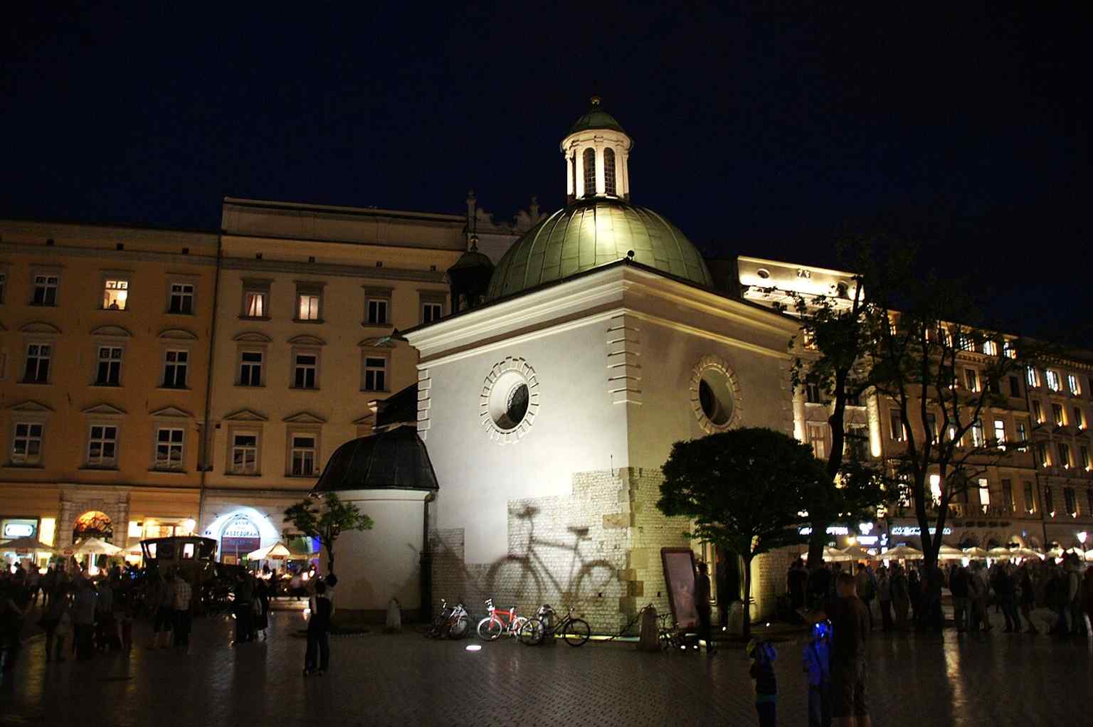 Another strong exterior showing the raised walls and dome added when the square’s pavement climbed above the old medieval floor level.