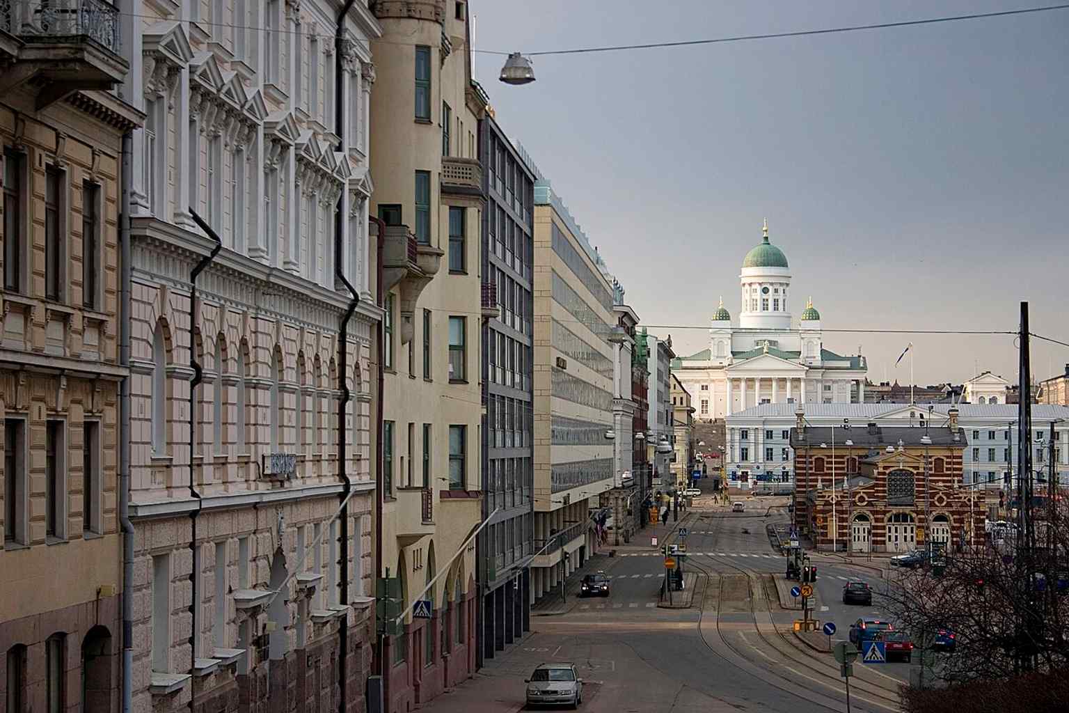 Helsinki Cathedral seen from the harbour side, with the Old Market Hall in the foreground and the church rising above the city skyline.