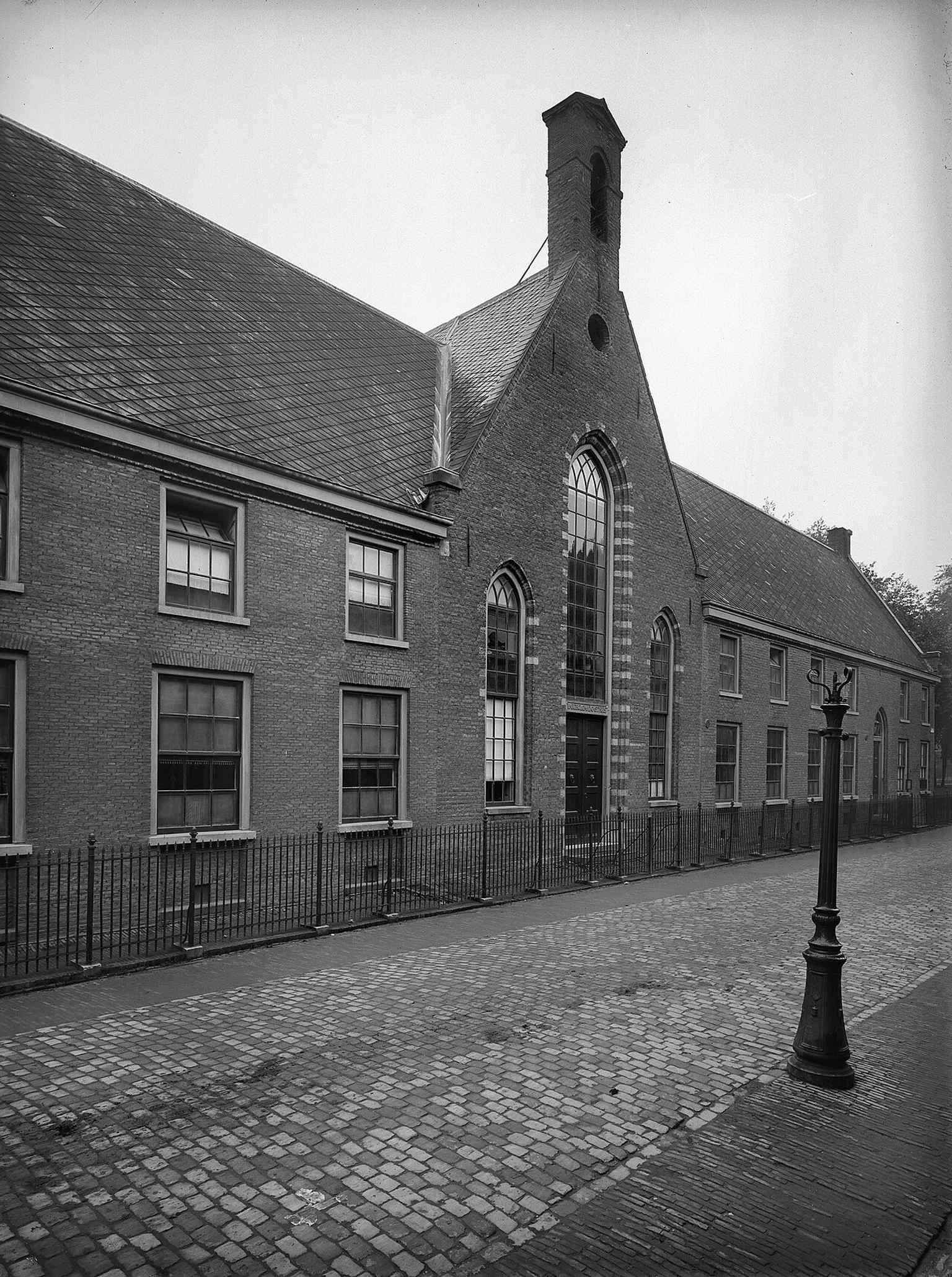 The historic front facade of the Bartholomeïgasthuis in 1920, showing its appearance after the significant alterations made in 1818 when it became a general hospital.