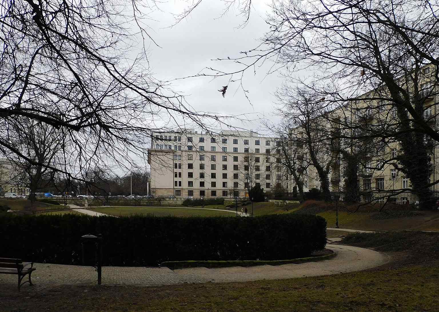 The park’s modern edge seen with the old party headquarters in the background, a reminder that only a small part of the original 1786 garden survived after the war.