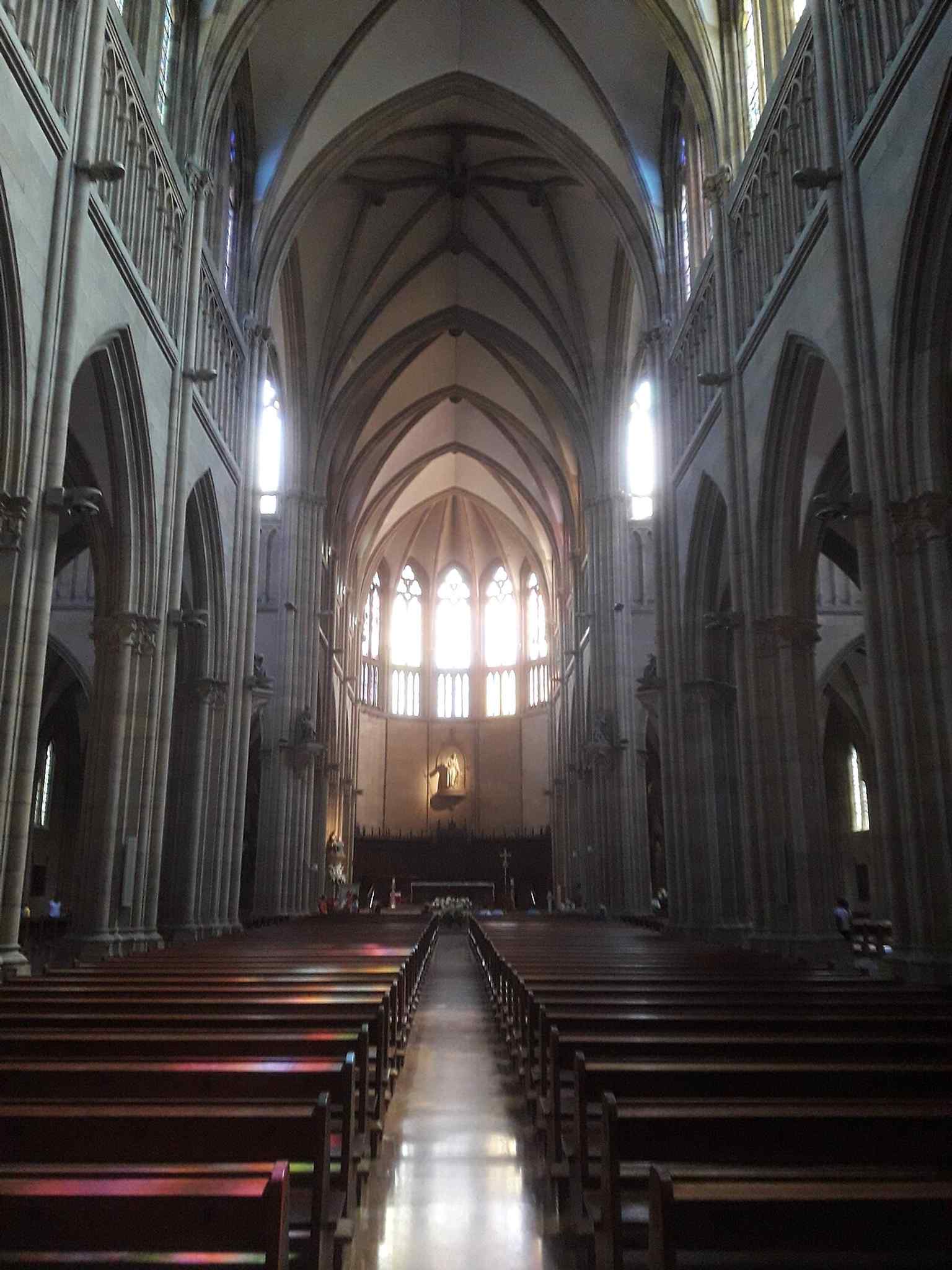 An interior view toward the sanctuary, where the cathedral’s liturgical life continues after the 1953 elevation to cathedral status.
