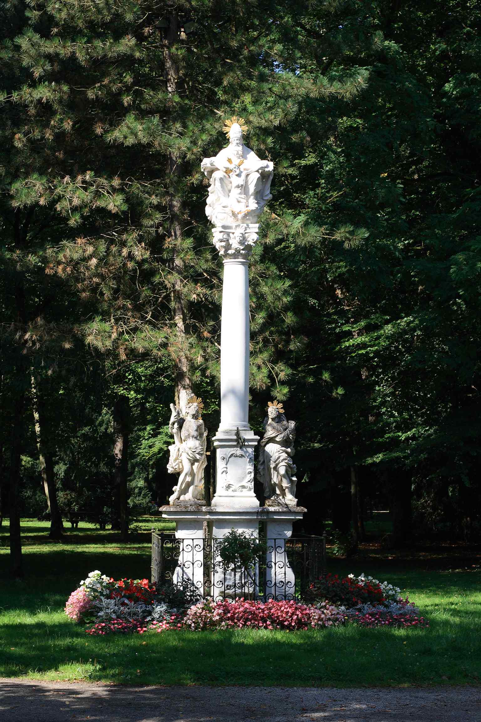 The Trinity Column in the Schlosspark links the castle grounds to the wider baroque park landscape around Lamberg.