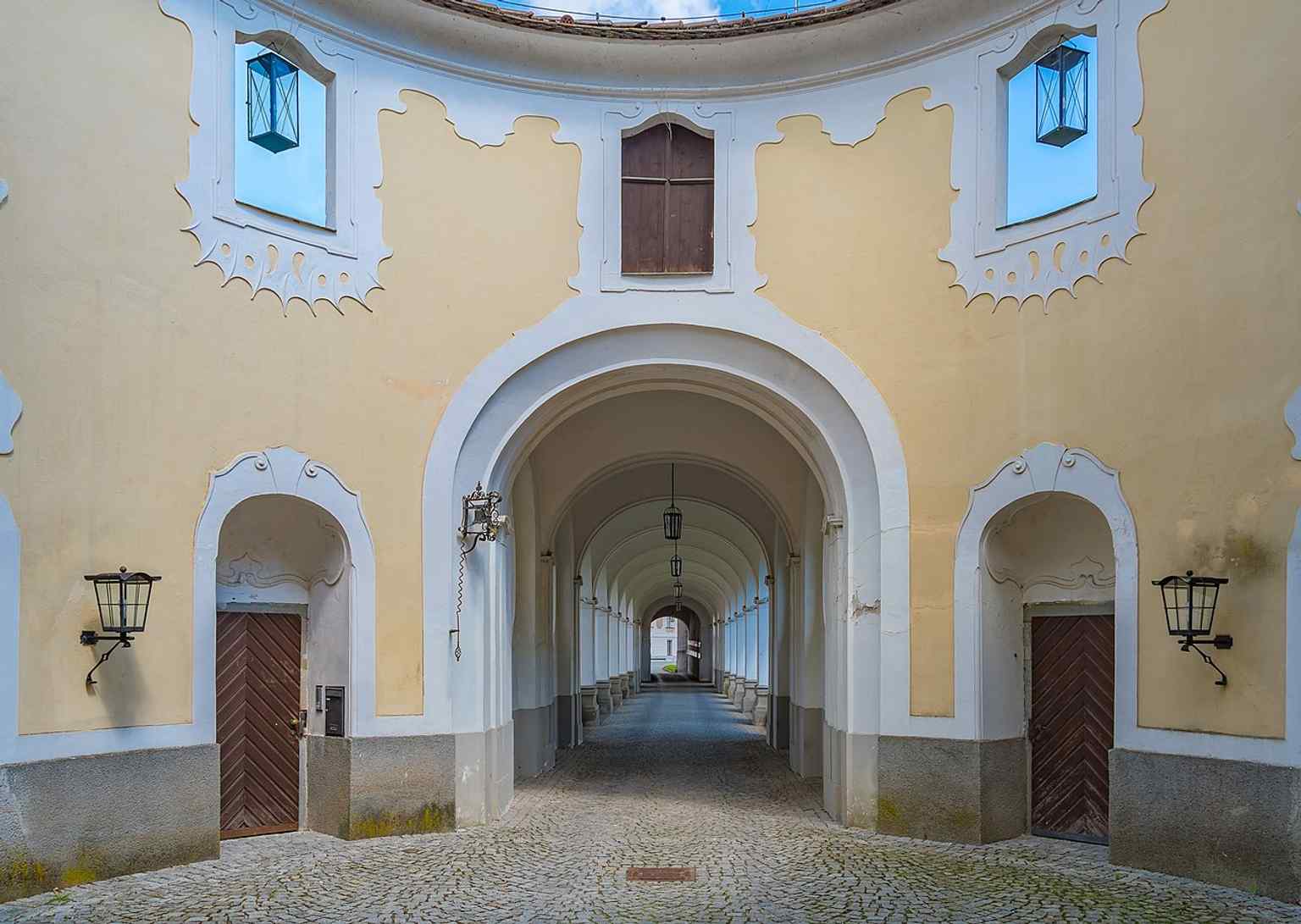 The castle courtyard in a recent state, useful for showing the renovated inner space where the fountain and sculptures were restored.