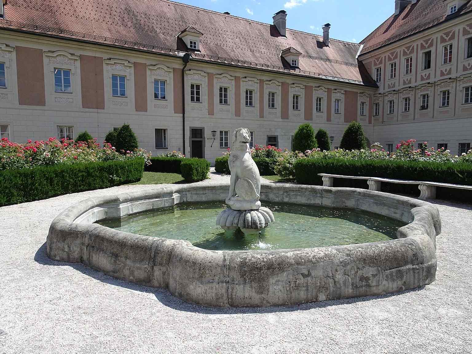 A close-up of one of the castle dwarfs, reflecting the quirky 18th-century satire figures now displayed in the Schlosshof.
