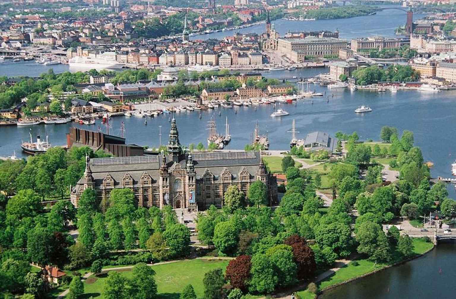 An elevated Stockholm panorama with Storkyrkan in the city fabric, emphasizing its position between the palace and the Old Town core.